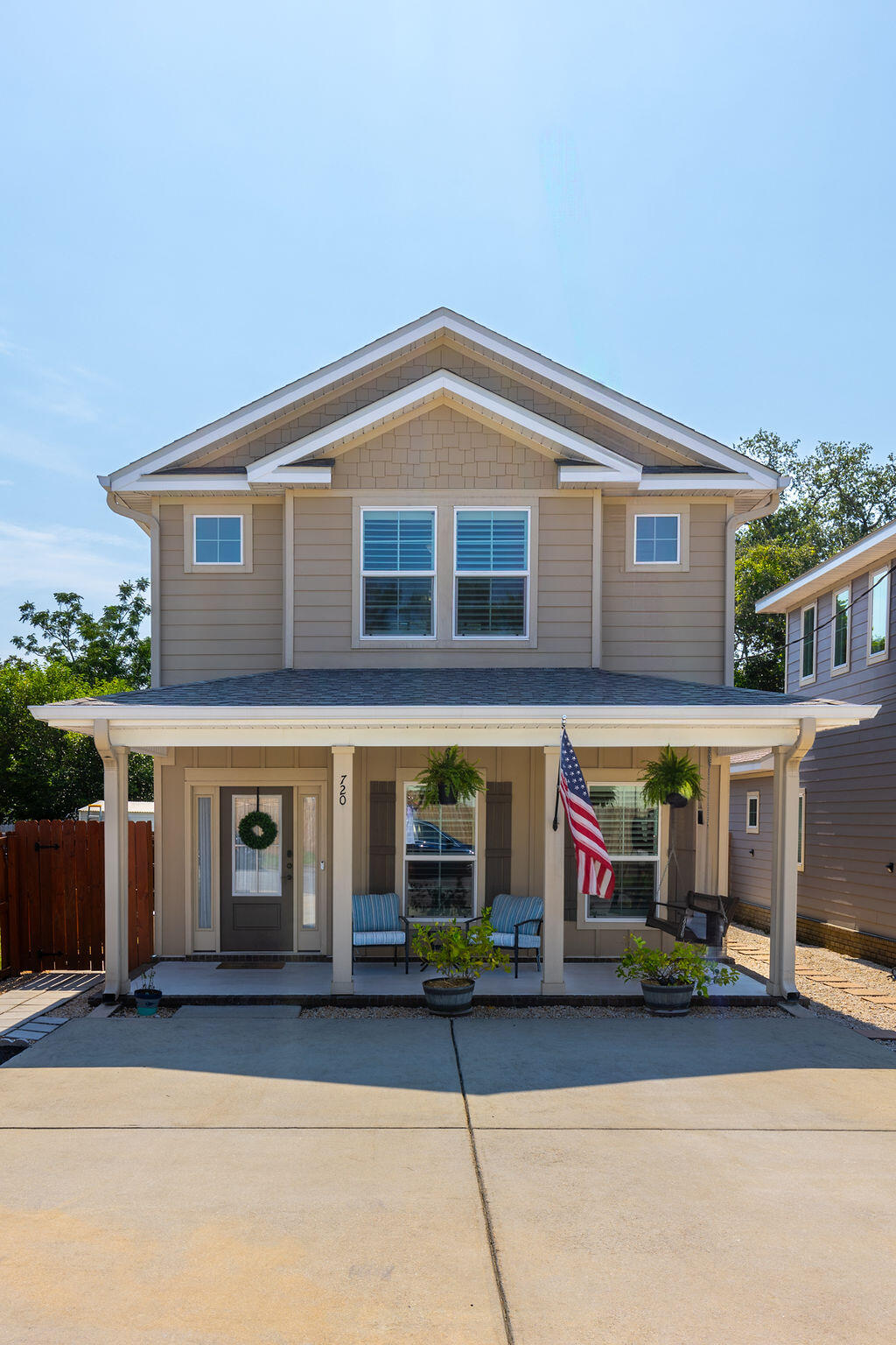 Welcome to 720 S N St, Pensacola! Be part of the downtown living vibe; in this virtually maintenance-free stylish modern two-story 2019-built residence built by English Homes, LLC with upscale finishes and upgrades throughout; sophisticated luxury vinyl plank flooring, recessed lighting, 9 and 10-ft ceilings, Kitchen with a center island, granite counters, stainless appliances, gas range, solid-wood soft-close cabinets; a custom pantry feature, upgrade to plantation shutters, a whole house new water filtration system installed, and MUCH MORE! This gorgeously designed home features both a front porch (8'x22') and back screened porch (10'x22') for the best of outdoor living too, with a backyard to be proud of. Enjoy the open concept layout with a HUGE Living Room, gourmet Kitchen with larg center island and gas range, along with a Dining/Office Area. The Primary Bedroom/Bath Suite is thoughtfully tucked at the rear of the first level for added privacy - the Master Bath showcases a beautiful freestanding soaking tub with large, frosted picture window, AND a separate tiled shower with frameless glass doors, double vanity, and a spacious 50 SF+ walk in closet! Bathroom Goals straight out of a magazine! A dedicated Laundry Room and separate Half-Bath off the living areas complete the first level, together with 22-ft wide front and rear porch spaces. Ascending the beautiful wood stairs, the landing features multiple windows for natural light. There are two additional Bedrooms upstairs; one with a large walk-in closet, and both with shared access to the large Full Bathroom with dual vanity, beautifully tiled over the bath, and large window. One bedroom is currently set up as a Home Gym, and could easily be a private dedicated Office/Flex Space, or as the 3rd Bedroom. Perfection inside and out, this near downtown Pensacola property features a private concrete drive for 2 cars, with additional street parking opposite. Enjoy the art of relaxation on your wide covered front porch featuring seating area and a beautiful wood porch swing. The rear fully screened Porch Room is 22 x15 ft, perfect for outdoor living, and features two ceiling fans, stringed patio lights, overlooking the immaculate backyard which is privacy fenced and has been upgraded to artificial turf, with a paved BBQ grill area and pea gravel hardscaping for low maintenance - no mowing! The side yard area is privacy gated with a small storage shed and room to store your bikes/beach gear, leading to the backyard which has been thoughtfully updated with artificial turf and features a pavered dedicated grill area, with room for your hammock under the canopy of a green space!  Hurricane shutters and newly installed gutters are also included for peace of mind. What the Seller loves about this home's location? "We are walking distance from the Oar House on scenic Bayou Chico overlooking the Bahia Mar Marina, Pearl & Horn, Emerald Republic, and Lost Pizza Co. We enjoy walking our dogs through Sanders Beach (near the Sanders Beach Kids Park and Sanders Beach-Corinne Jones Resource Center) as well as around Kiwanis Park. We are only 1.6 miles from downtown so it's very convenient to bike to Blue Wahoos games, Joe Patti's, or to any of the attractions on Palafox. We're about a 10-minute drive from the East Hill neighborhood, 15 minutes from the Pensacola Airport and Mall, and just 10 minutes from the NAS Pensacola Main Gate."  Just a few of the perks to living near downtown Pensacola!
