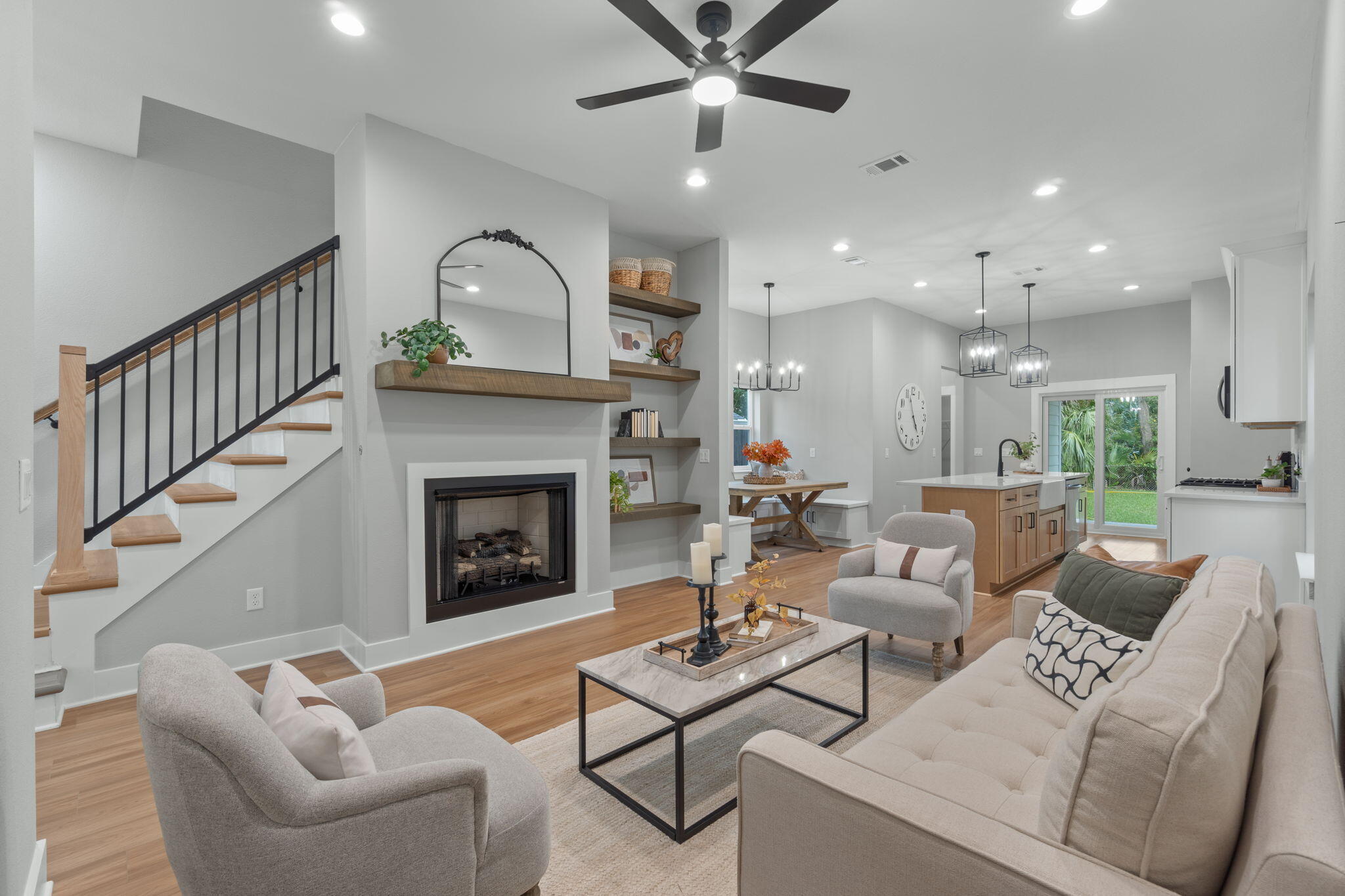 Experience the best of downtown living in this adorable, semi-custom craftsman-inspired home, perfectly situated just moments away from Pensacola's most vibrant restaurants, bars, and entertainment. Enjoy the energy of the city while coming home to your own peaceful retreat filled with comfort, charm, and timeless design. Step inside to discover a thoughtfully designed floor plan offering 3 spacious bedrooms, 2.5 bathrooms, and a private study or home office — ideal for today's modern lifestyle. The open-concept kitchen and family room are the heart of the home, featuring 10-foot ceilings, tall cabinetry with crown molding, gleaming quartz countertops, stainless steel appliances, and a free-standing gas range — all combining to create a space that's as functional as it is beautiful. The gas fireplace adds warmth and ambiance, while the built-in breakfast bench and table offer the perfect spot for morning coffee or casual gatherings. Step out back to your covered patio and private yard, a perfect setting for barbecues, quiet evenings, or entertaining friends under the stars. The oversized master suite is a true sanctuary, featuring a spa-like bathroom with dual vanities, a free-standing soaking tub, and a fully tiled, glass-enclosed shower  a rare luxury in this neighborhood. Ample walk-in and linen closets provide generous storage, adding to the home's comfort and convenience. Built with integrity by a family-owned company that builds homes with heart, this residence reflects exceptional craftsmanship, quality materials, and a genuine dedication to customer satisfaction. From the tankless gas water heater ensuring endless hot water to the premium finishes throughout, every detail has been carefully curated for modern, comfortable living. This is not your average builder-grade home  it's a true gem where elegance meets everyday ease.