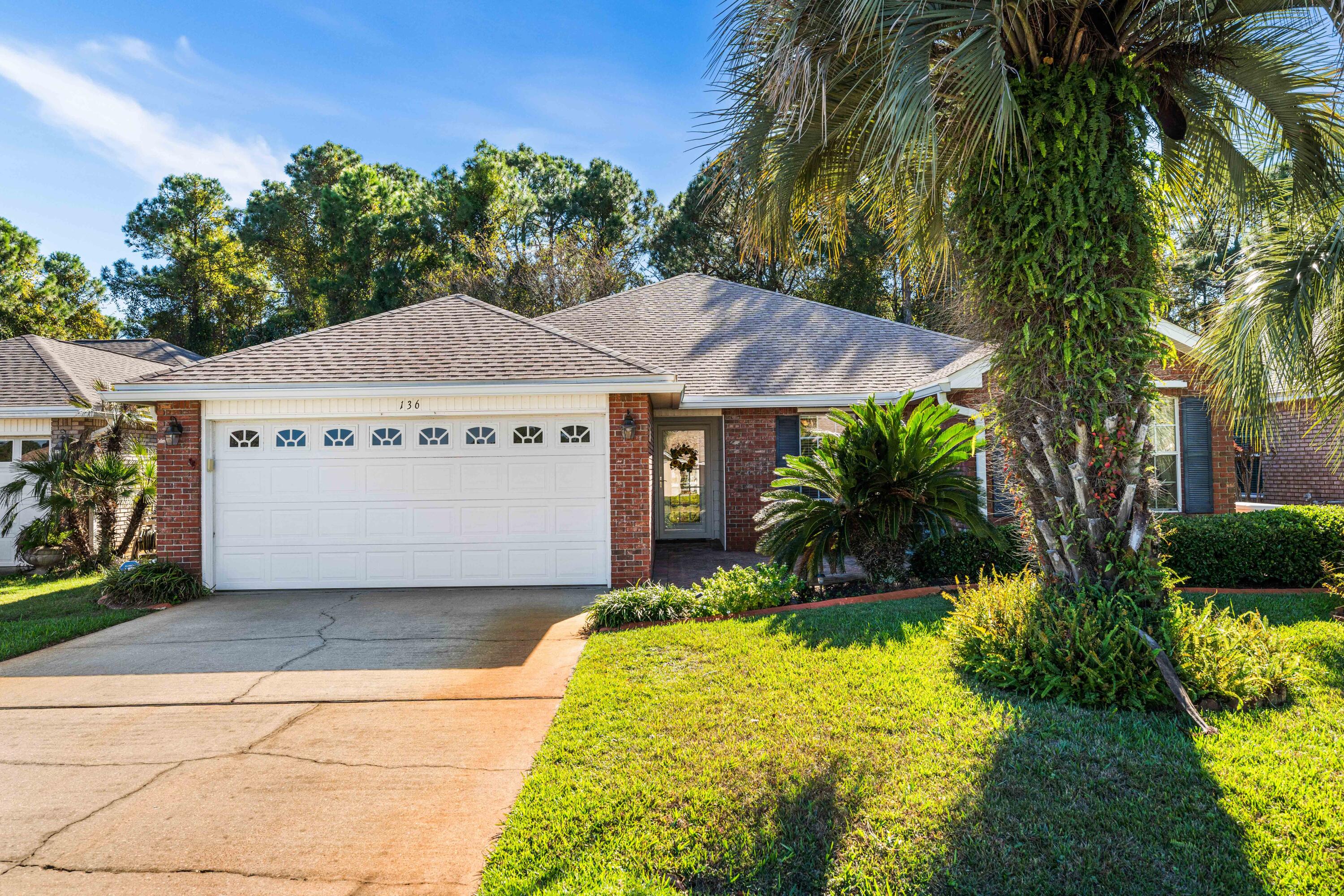 Welcome to 136 Bay Tree Drive in the Bayside community!

Discover this beautifully updated home, offering a seamless blend of modern upgrades and timeless charm. Thoughtfully renovated since 2018, the property boasts:
•	Interior Enhancements: Freshly painted walls, crown molding, and custom shelving in the master bedroom closet. All popcorn ceilings have been removed, and new flooring flows throughout the living areas and bedrooms.
•	Kitchen Renovation: Featuring all-new cabinets, countertops, backsplash, and appliances, complemented by a spacious kitchen island, built pantry cabinet, and a stylish new sink and faucet.
•	Bathroom Upgrades: Both bathrooms now include updated vanities, sinks, faucets, mirrors, and a new shower door in the hall bath. "	Additional Features: A cozy new fireplace mantle and surround in the living room, and updated light fixtures and ceiling fans throughout.
Outdoor and Structural Improvements: The front entrance features a new storm door, while the backyard includes a French drain for enhanced landscaping.
Modernized Systems: A whole-house generator, a replaced HVAC system (interior and exterior), and a new hot water heater provide peace of mind.
The property also offers an open-concept layout, with a heated and cooled former screened-in porch that adds versatile living space. Bayside has wonderful amenities that include a community dock and fishing pier, tennis courts and a swimming pool. All dimensions are approximate and should be verified by buyer.
Don't miss this turn-key opportunity in a prime location - schedule your showing today!