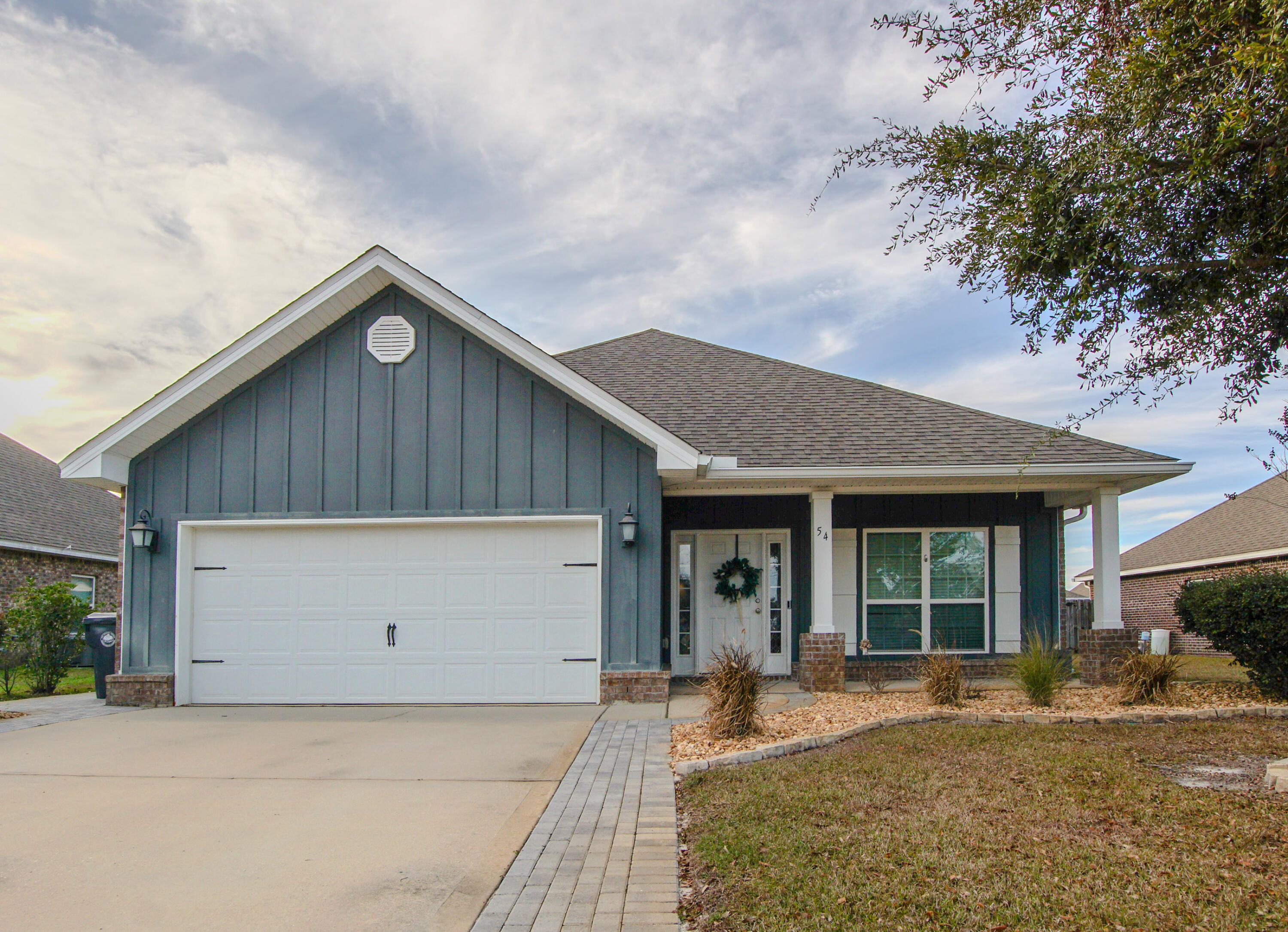 Beautifully Upgraded 3-Bedroom Home Overlooking Central Park in Freeport's Hammock Bay!

Welcome to 54 Lottie Loop, a beautifully maintained 3-bedroom, 2-bath home with a versatile flex room, perfectly positioned to face Central Park in Hammock Bay—a large open green space featuring a covered grilling pavilion. This prime location allows you to walk to all the wonderful Hammock Bay amenities, including the clubhouse, fitness center, pools, and more.

Since purchasing, the sellers have thoughtfully enhanced the home with numerous upgrades that elevate both style and functionality. The front and back flower beds have been finished with decorative rock and lined with attractive pavers for a clean, low-maintenance look. Additional pavers widen the front driveway for extra parking and expand the back patio, creating more space for grilling and outdoor entertaining. The screened-in porch patio includes a convenient doggie door and features a gas stub-outperfect for an outdoor grill setup.
Inside, the home offers quality finishes throughout, including granite countertops in the kitchen and all bathrooms, stainless steel appliances, and updated kitchen hardware. Select light switch and outlet covers have been replaced with elegant gold accents, adding a subtle designer touch. The primary suite features a garden tub and a separate tiled shower, while crown molding highlights the entry, family room, and primary bedroom. Wood-look tile flooring runs throughout all common areas, bathrooms, and the utility room, combining durability with modern style.
Additional features include three-sided brick construction, a gas hot water heater, rear gutters, professional landscaping with sprinkler system and well, and a privacy-fenced backyardideal for relaxing or entertaining.
With its park-front setting, walkable amenities, and extensive list of upgrades, 54 Lottie Loop offers exceptional value and a lifestyle that's hard to beat in Freeport. Call today to make this home yours.