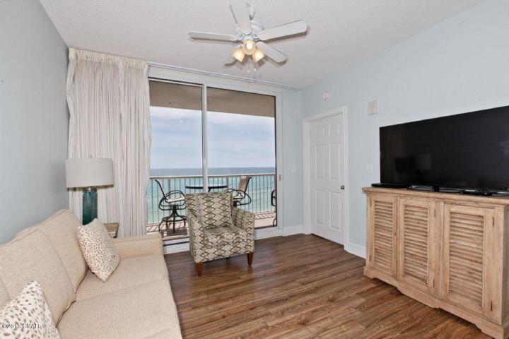 BEST OF THE BEST IN MAJESTIC! PERFECT ELEVATION WITHIN THE STACK!! This one of a kind property conjures up images of sun-splashed days of swimming, biking, and relaxing. It lives like a beach house but comes with all the benefits of owning a condo. This property has been meticulously maintained. Hard surface flooring throughout and conveys with luxurious furnishings, window treatments, and artwork that welcome you to lie back, relax, and enjoy panoramic views of the pool, beach and ocean. Condo has 9' ceilings and crown molding throughout. Open floorplan allows for fabulous Gulf and sunset views from balcony, living room, dining room, kitchen, & master suite providing the ultimate alfresco living and entertaining environment!. The fully equipped kitchen features upgrades