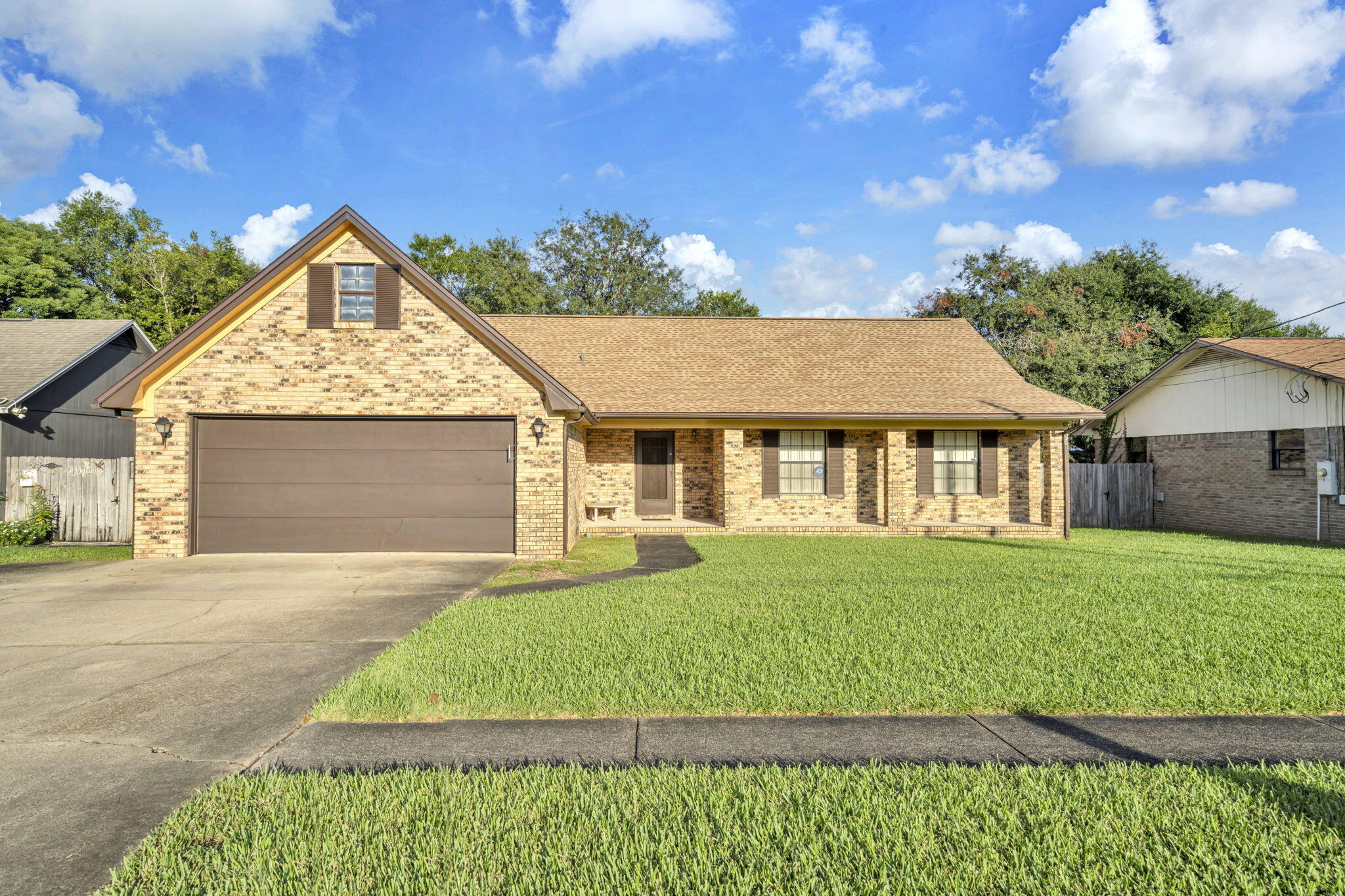 This charming 3-bedroom, 2-bath home located in the popular ''West End'' Destin offers 1,630 sq ft of well-maintained living space with a layout that's both functional and welcoming. The eat-in kitchen sits just off the cozy living room with fireplace — perfect for entertaining or relaxing. Enjoy peace of mind with major updates including a current roof, electric panel, and hot water heater. Outside, the lawn is pristine and fully supported by a lawn pump and sprinkler system, with a privacy-fenced backyard that adds both charm and function. Located on a quiet street with sidewalks, this home is close to great restaurants, water sports, shopping, and Destin's amazing beaches.