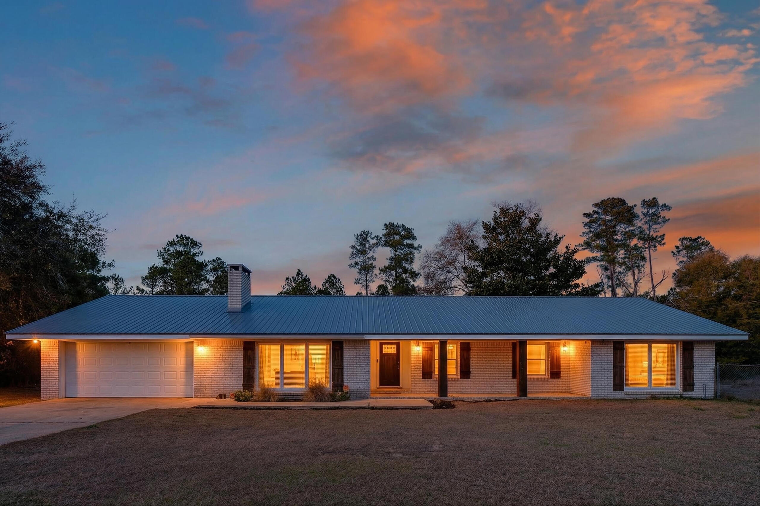 ** UNDER CONTRACT WITH A 72 HOUR KICK OUT CLAUSE.** Welcome to your own slice of country comfort on 1.76 acres! This spacious 5-bedroom, 2-bath ranch-style home blends charm, functionality, and room to roam. Inside, you'll love the cozy living room with a beamed ceiling and wood-burning fireplace—perfect for relaxed evenings at home. The beautifully renovated kitchen features granite countertops, stainless steel appliances, and updated flooring, flowing seamlessly into a generous dining area with a convenient counter-height bar for casual meals or entertaining.

Four bedrooms and two bathrooms are tucked together on one side of the home, while the fifth bedroom or oversized bonus room sits privately on the opposite end—ideal for a playroom, media space, guest suite, or hobby room. There's even an extra flex room perfect for a home office, gaming space, or secure storage.

Step outside and enjoy the enclosed back porch, rear patio, and fenced areagreat for outdoor fun and gatherings. Need space for toys, tools, or travel gear? The impressive 40x60 pole barn has you covered with room for an RV, 100-amp service, water, lighting, and outlets.

Recent updates add peace of mind, including new windows (2018), a metal roof (2020), and a new well (2024). Garden lovers will appreciate the fully irrigated garden, and yesthere's even a hurricane-proof chicken coop that comes complete with laying hens and a tractor/trailer combo for ease of completing outdoor chores!

This property offers the space, upgrades, and versatility to truly enjoy the lifestyle you've been dreaming of!