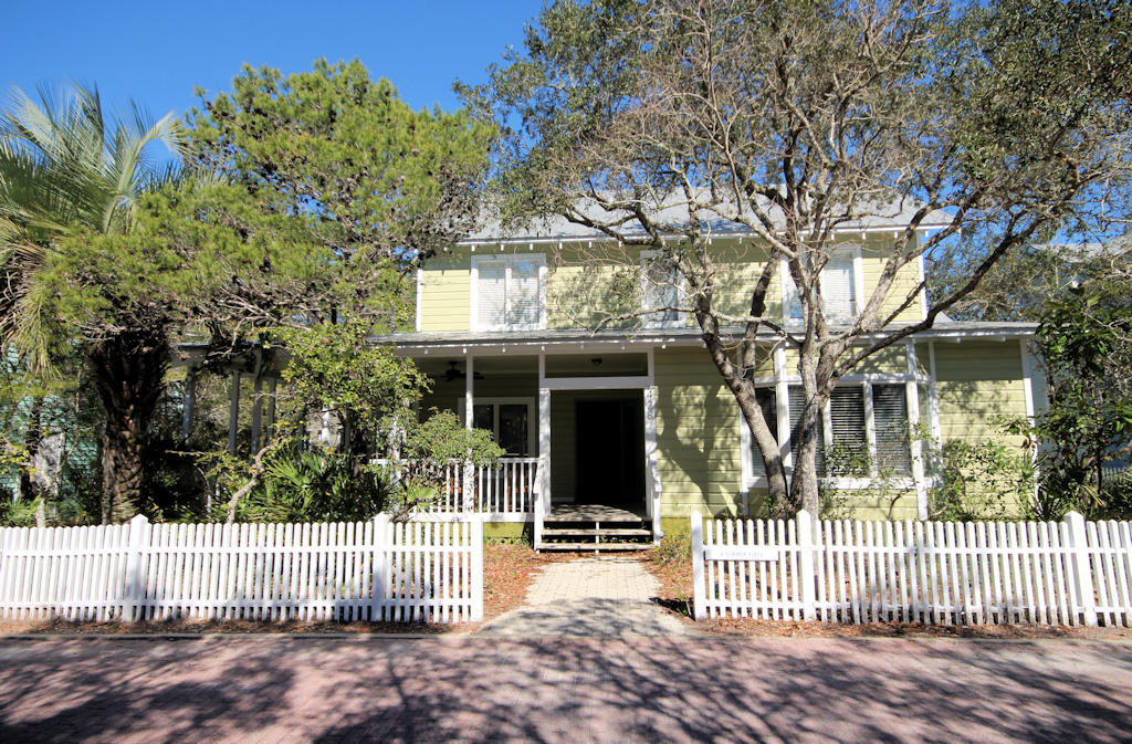 A Summer Place is a traditional Florida beach cottage that will bring back favorite memories of your family's summer vacations. Located within a block from 30A, just a five minute stroll to the beach, pool or Seaside town center. A neighborhood park one house away features a grill and picnic table for a fun family outing. The wrap-around porch is spacious enough for outdoor dining and additional outdoor living space. The perfect location to relax and listen to grandparents reminisce about how they spent their childhood vacations at the beach. French doors open on to the porch from the living area. Natural finished wood walls and pine floors are found throughout the cottage. Bay windows in the kitchen and living area fill the cottage with sun light. The kitchen has been upgraded with marble countertops and glass tiles. Start your day in the kitchen breakfast area sipping your morning coffee or tea. The U shaped kitchen with island and wet bar can accommodate the family chef with plenty of room for the next generation of inspiring chefs. You will find a plethora of storage in this kitchen behind the maple cabinetry. The separate dining area has a buffet nook and ample room for a farm house table. First level guest bedroom with full bath opens onto the porch by a set of French doors. Access the outdoor shower from porch or bath. Second level features two master bedrooms each with a private bath and vaulted ceilings. Includes onsite private parking for 3 cars. Room to expand the cottage.
