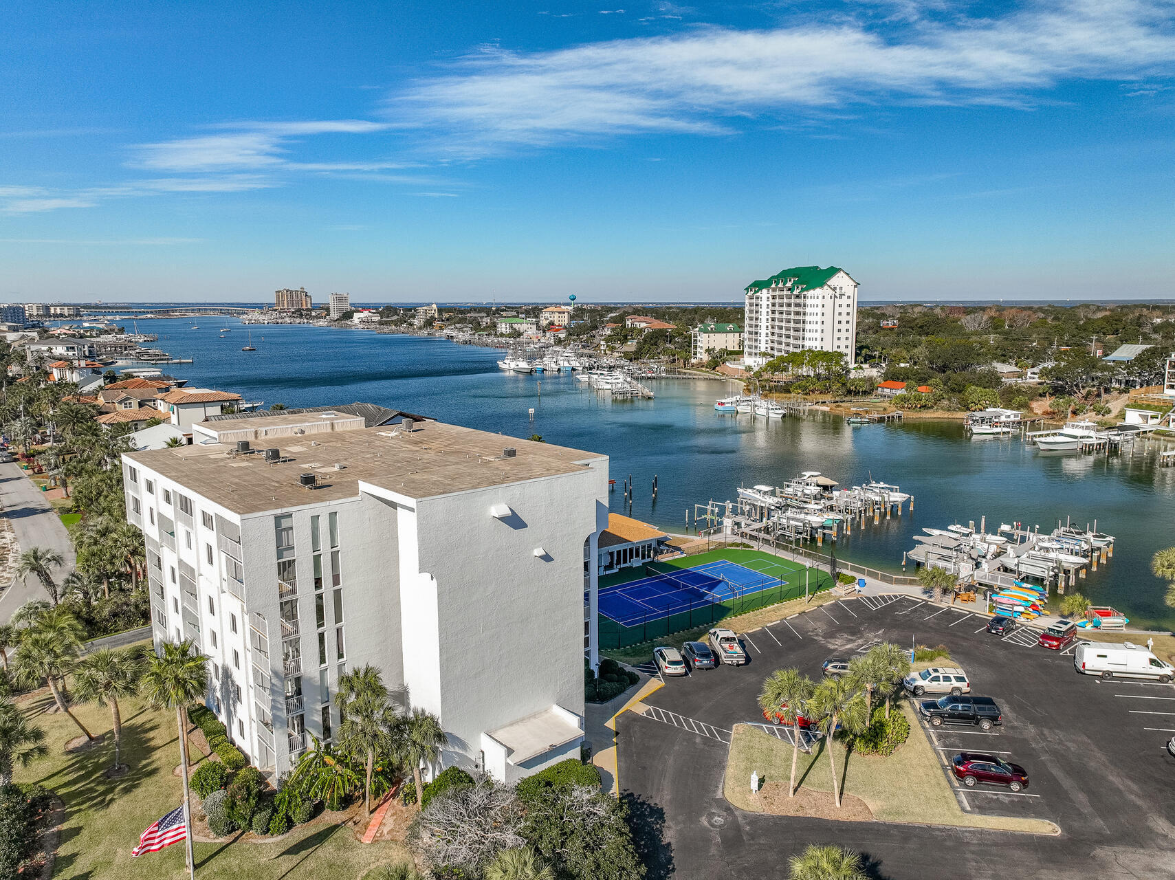 Fantastic 4th floor waterfront condo located on Holiday Isle. Turn-Key vacation rental (sold completely furnished including bicycles and kayak), vacation home or permanent residence. 

Completely refreshed with unobstructed view of Destin Harbor. Watch the dolphins swim by from your waterfront balcony. This unit is gorgeous, with quality, tasteful furnishings throughout.

Ceilings are white shiplap, fresh neutral paint throughout. Premium luxury vinyl flooring throughout - no carpeting! All new Impact Windows and Sliding Doors, HVAC, water heater and garbage disposal. 

Kitchen has granite countertops, stainless steel appliances, fresh white cabinets and food pantry. 

Master bedroom with en-suite bath and generous closet. Bathrooms upgraded - tile, showers, vanities. Washer/dryer hook-up. Included is a 15' x 5' storage unit located on the same floor that can be used as owner storage or vacation rental storage. The Dolphin Point community has excellent onsite property management. Amenities include tennis and pickle ball courts (newly updated), pool, club house and marina. Access to the beautiful Gulf of Mexico and private Holiday Isle white sand beaches are at the end of the street. Your condo dues include water, internet and basic cable.