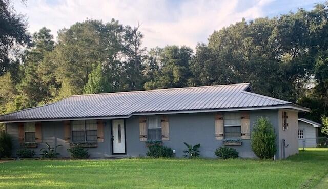 Conveniently located off of Hwy 331 on a private cul de sac. This home has many  quality features recently added.  Vinyl plank flooring, tile flooring, tile countertops and tile backsplash. 4 bdrs, 2 baths, living, dining, kitchen. laundry rm, and a large family room.  The oversized screened  back porch w/outdoor sink/cabinet/bar area overlooks the landscaping and backyard. The large backyard has a privacy fence w/dbl gates. 2 sizable storage buildings and is nicely landscaped. Storm doors on front and back. French doors lead into the private, master suite area. This residence is in great shape and is ready for occupancy.