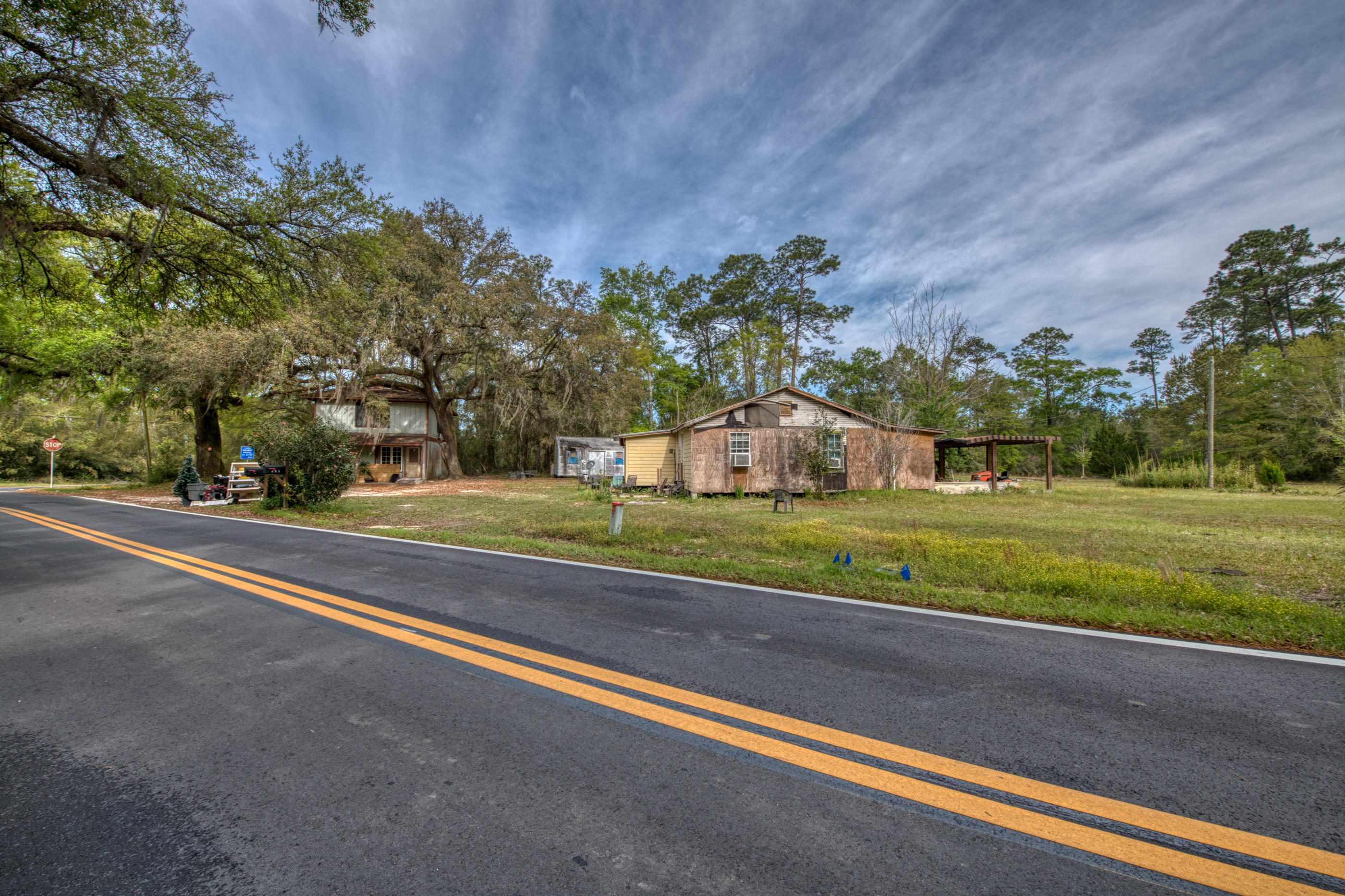 $40,000 PRICE REDUCTION! VERY motivated seller! 1.4 acres with Highway 20 frontage is a Builder and Investor OPPORTUNITY! This corner lot is currently zoned Residential Commercial (please see Zoning Maps uploaded in documents). Perfect for building easily accessible townhouses, apartments, your dream house, or a business, restaurant, etc (Please see the Residential/Neighborhood Commercial District (RC) Document uploaded to documents for allowances of usage on the property). Located less than half a mile from Highway 331 and conveniently located in the quickly developing area of Freeport. Only 11 miles to Highway 98 in Santa Rosa Beach. Only 17 miles to DeFuniak Springs, FL. 20 Miles to the EOD Schoolhouse. 23 Miles to Niceville, FL. 31 Miles to Eglin AFB. This area of Freeport is booming. There are 2 buildings on the property that are being sold As-IS due to the condition of the existing structures. The value is in the land and location. 320x432x25.2x175 is the approximate lot dimensions, but Buyer is to verify all measurements via Survey .... Seller does not have an up to date survey. Respectfully, Buyer will need to purchase/order a new survey.