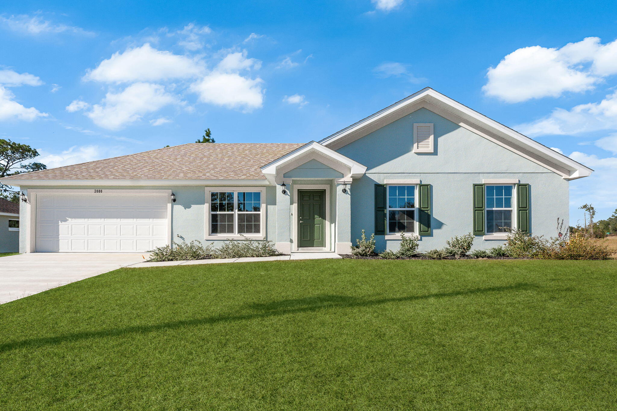 Explore the Sage floorplan by Homes by Deltona, an elegant three-bedroom, two-bathroom home in Sunny Hills. This inviting residence features an open-concept living area with vaulted ceilings and a chef's kitchen with granite countertops and stainless steel appliances. Enjoy luxurious, low-maintenance luxury vinyl plank flooring throughout and restful nights in bedrooms with plush carpeting. The solid concrete block construction adds durability, while the split bedroom layout ensures privacy. The primary suite offers a walk-in closet and double vanity sinks. Outside, a beautifully landscaped yard with an irrigation system awaits. With a 1-2-10-year builder's warranty, this home combines comfort and peace of mind. Don't miss the chance to make the Sage floorplan your forever home!