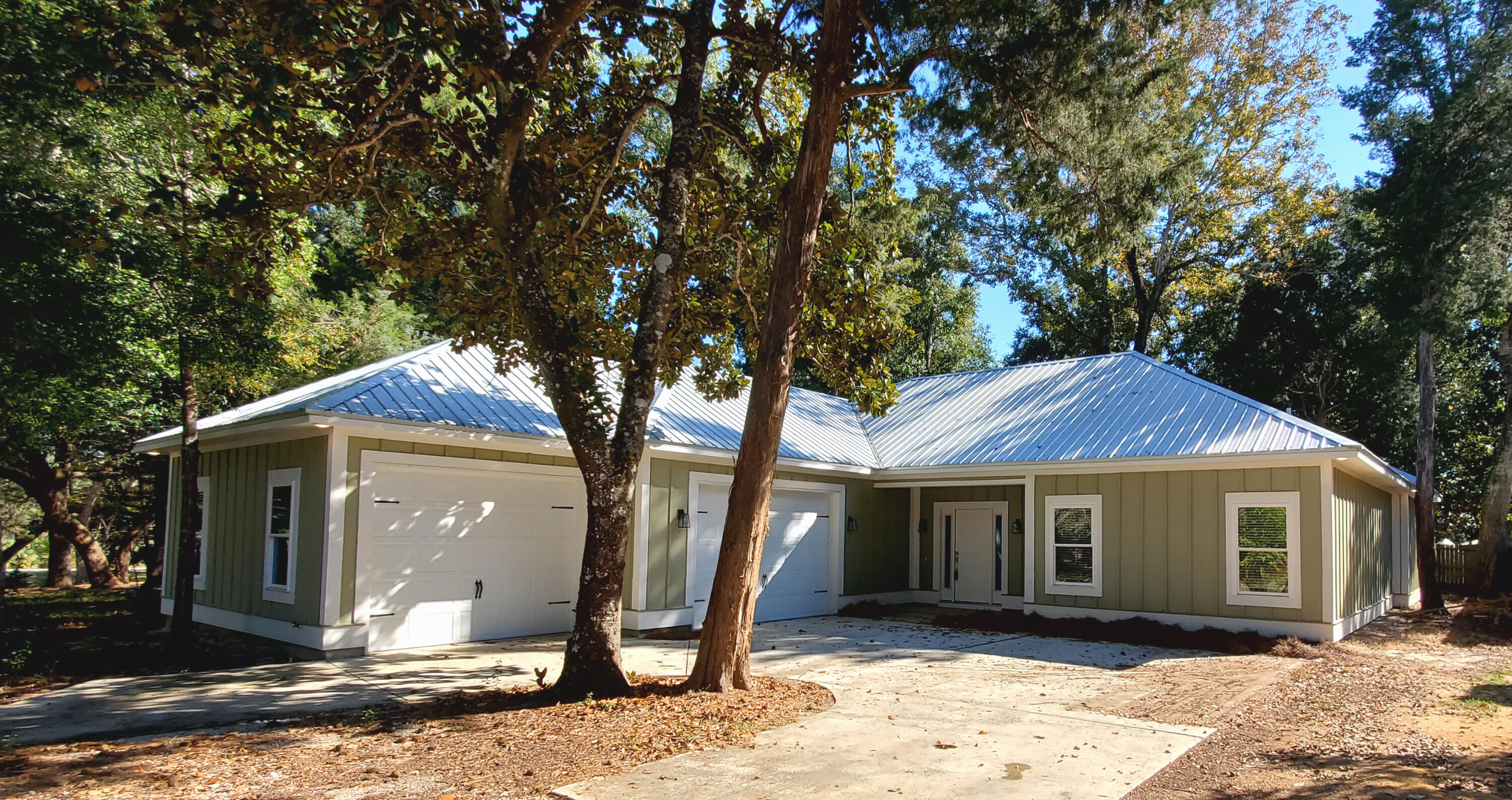 PRICE IMPROVEMENT! Beautiful like new home in a peaceful quiet neighborhood conveniently close to bay side parks, military bases and just down the road from Bluewater Bay and Mid-Bay Bridge for access to Destin Commons, beaches and amenities of Destin & South Walton. This home offers a smart, open floorplan with low maintenance metal roof along with polished/stained concrete flooring and recessed lighting throughout. Clean & sharp. Upon entering you will notice the spacious living room flowing into the well-appointed kitchen with stainless steel Whirlpool appliances, gas range with stainless steel hood, kitchen island with extra cabinets and handsome kitchen cabinets and soft close drawers. The master bath has a nice sized jetted tub and separate easy access spacious shower with dual shower heads along wit double vanities. 2 more guest rooms with great closet space and one having another private bathroom. Don't forget about the oversized 2 door garage with shelving and plenty of room for projects and more storage. Located in Walton County with lower property taxes. This home also offers a tankless water heater for instant hot water. All of this nestled in a peaceful setting yet parks, shopping, grocery, restaurants, entertainment and so much more are just down the road. This is an as is sale. Come and see. Buyer to verify all measurements and information.