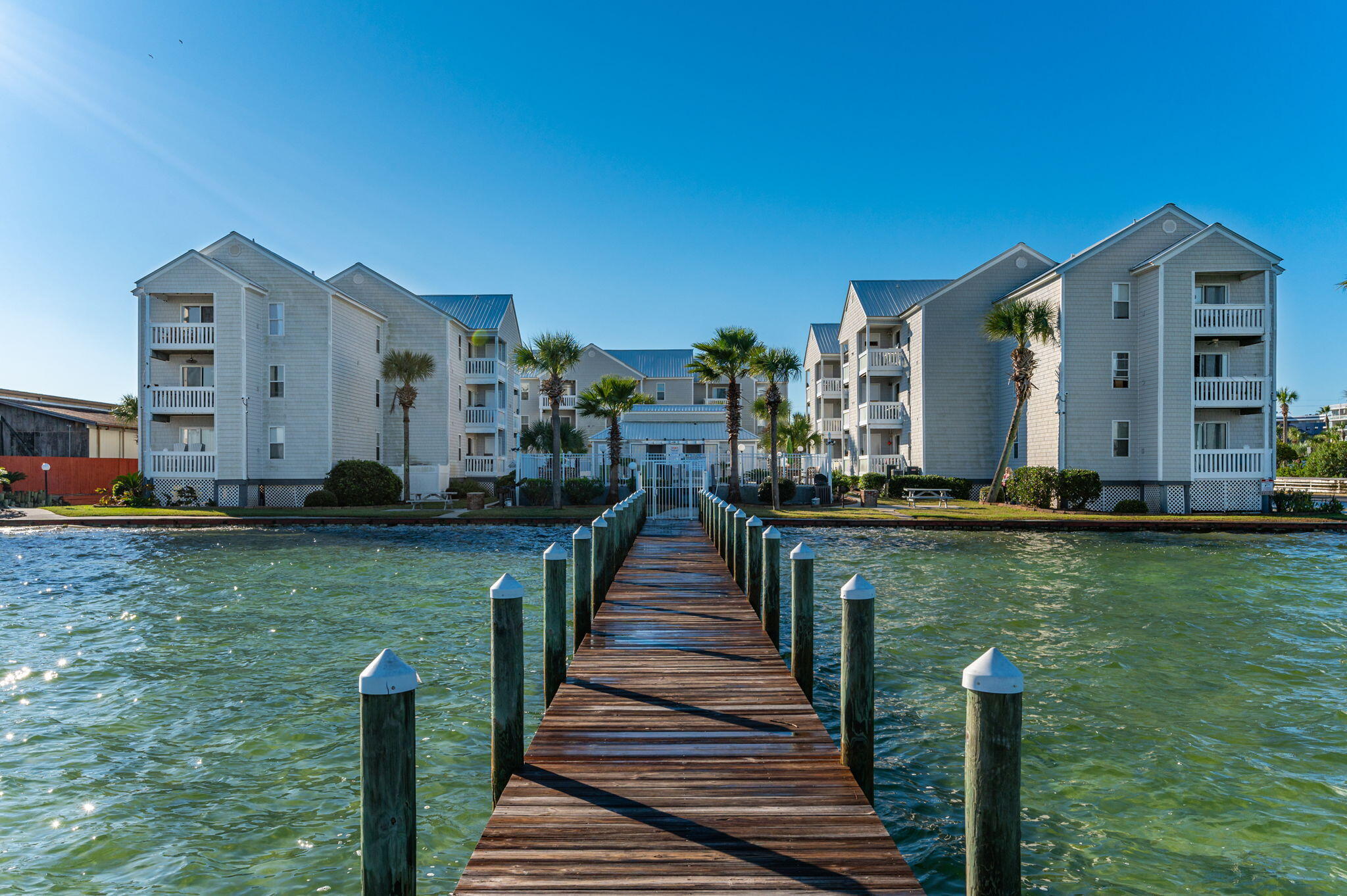 Located in the heart of Okaloosa Island with a gorgeous view of the bay and directly across the street from the beach, this 2 bed/ 2 bathroom condo is exactly what you have been looking for.   Condo is fully furnished and boasts an open floor plan and new HVAC, water heater, washer/dryer, microwave, and paint.  Unit has access to a community dock, bay front pool and BBQ area.  With a proven  rental history, reserved parking space and  ideal location close to local attractions and shopping, this is the home or rental property you have been looking for on the Emerald Coast.