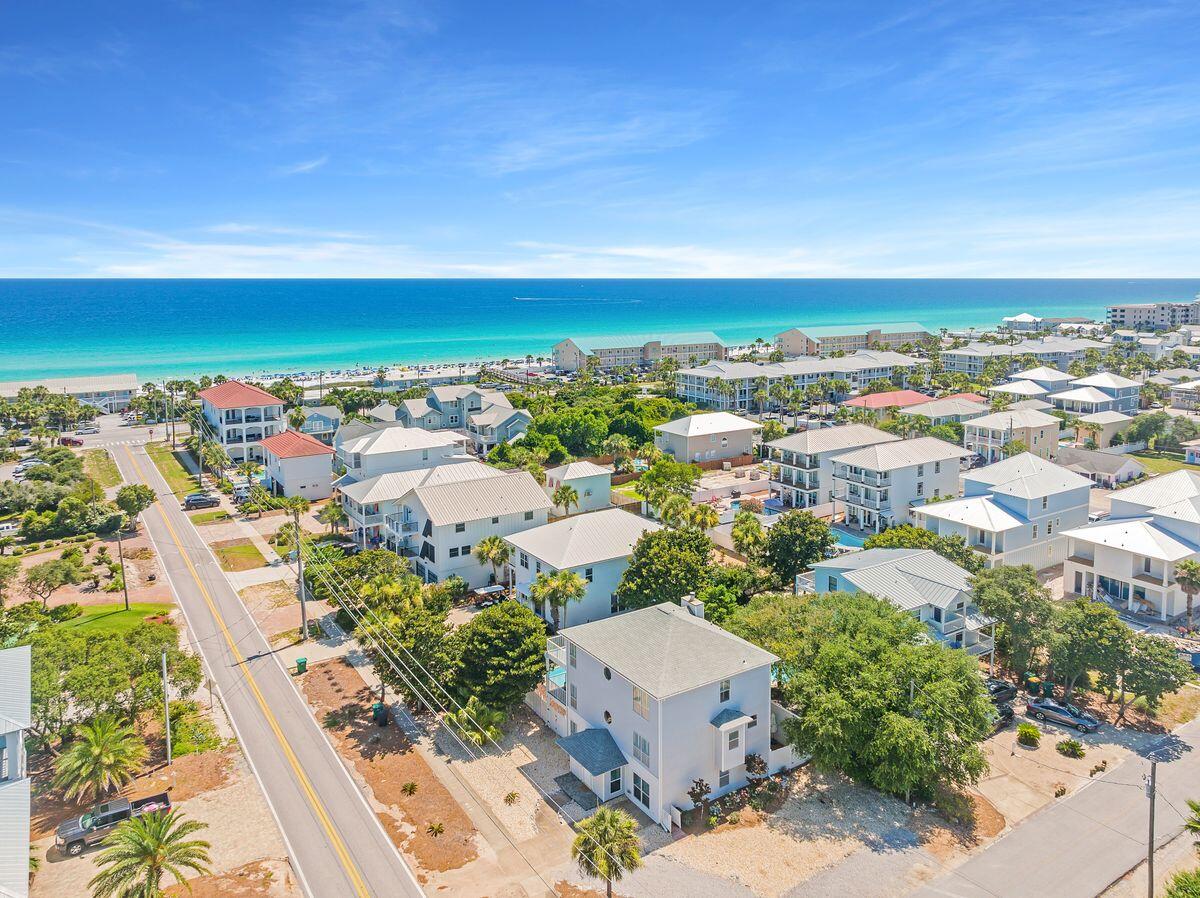 Enviably located yards from beautiful Crystal Beach, this imposing three-story beach house comes with guaranteed income and no HOA fees. Each level has a full-width balcony overlooking the (heated) pool and enclosed backyard. The covered terrace is perfect for barbecues and poolside entertaining. Stretch out on lounge chairs with a book while youngsters frolic in the water. The spacious home has easy-to-maintain wood and tile floors throughout. The foyer entrance hall leads to a large bunk room, a full laundry room and a second kitchen/utility area. There's another bedroom with full bath and a bright game room with sliding doors to the pool. Head upstairs to the main open living area. Gleaming wood flooring enhances the sitting/TV area and the adjoining dining area with fireplace feature. The eat-in kitchen has an angled breakfast bar for six. Mornings start here with breakfast while mapping out the day's activities. There's a guest bedroom and full bath with tub on this level. The third floor has a generous master ensuite with double vanity, walk-in shower and a full wall of closet space. Two more bedrooms and a full bath accommodate more guests. The large top deck overlooks the pool and is perfect for sunbathing or gathering at sunset to toast the end of another beautiful day. Buyer to verify all information and dimensions.