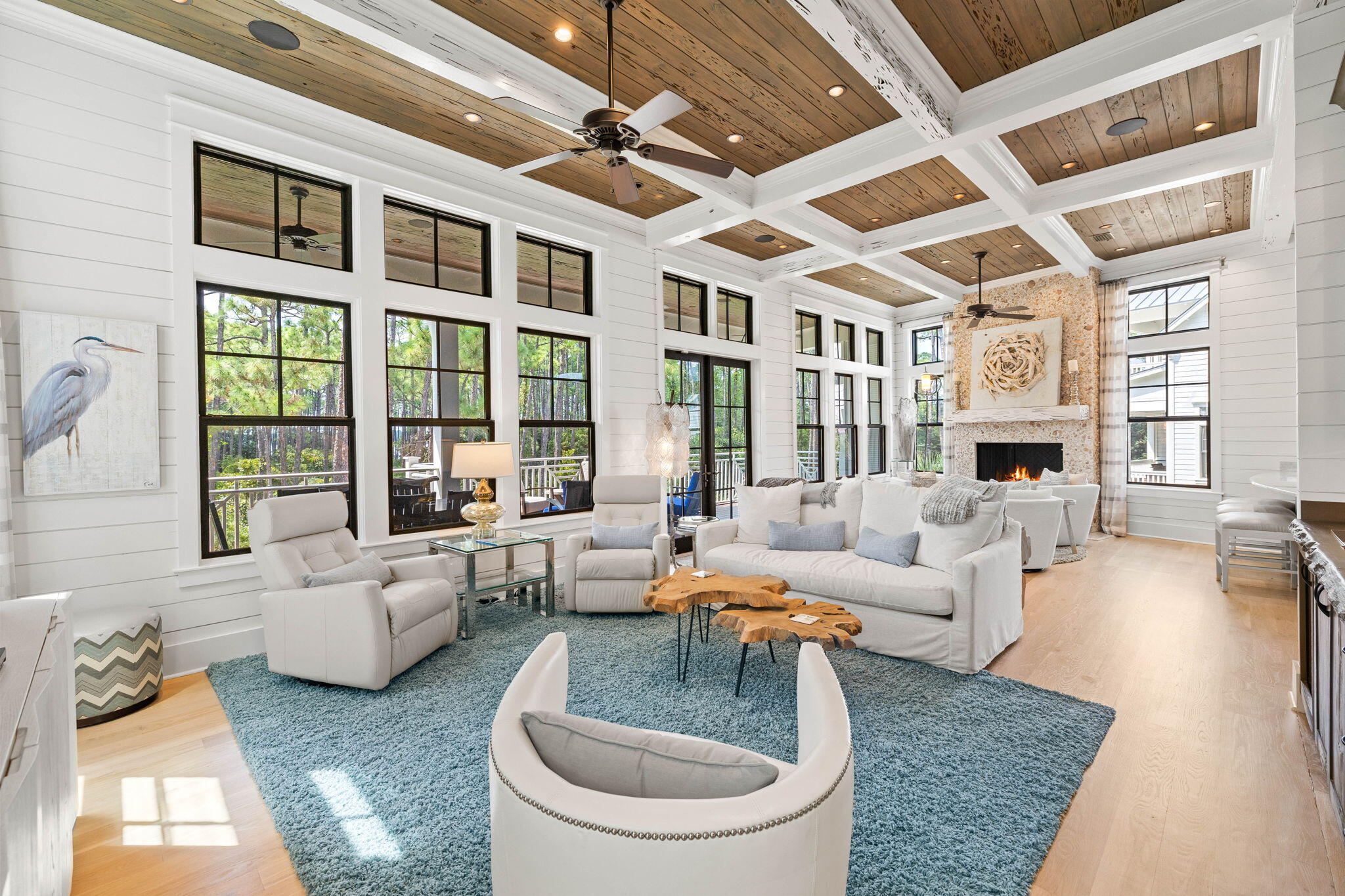 One of a kind rare opportunity to own a beach masterpiece south of 30-A in WaterColor Resort. This beach estate is custom furnished by award-winning Lovelace Interiors in a Rustic Modern style with a coastal flair featuring clean lines and finishes of grays, creams and ice blues that play with and reflect light. 

Uniquely positioned on a corner lot adjacent to Western Lake and the Gulf of Mexico, this property adjoins Grayton Beach State Park's rare Coastal Dune Lakes and its pine forests. With three levels of luxury living, this stunning residence radiates elegance and grandeur. Custom built by James A Rice and designed by Thurber Architects, this home is as unique as its surroundings. It offers 5 bedrooms, including a double-bunk room, 4 Full baths + 2 Half Baths and is constructed with only the finest materials. Custom reclaimed Pecky cypress was selected for: kitchen cabinets & hood, interior doors, curved entry walls, and beamed ceilings. Features include an elevator, chef's gourmet kitchen equipped with Thermador appliances, 56 bottle wine cooler, Shiplap plank walls, 5'' white oak plank floors, cedar plank exterior, imported tile, Carrara marble countertops throughout the bathrooms and kitchen, 3 wet bars, ice machine, 2 gas fireplaces, security system, Sonos, 2 car garage with 14'ceilings in case one might need a car elevated, and lighted landscaping. 

The first floor will impress immediately with 14' Pecky cypress ceilings and reclaimed Pecky cypress walls which adorn the entry way leading to the stairway and elevator. This floor hosts one master suite, a second bedroom and a bunk room equipped with four bunks, each hosting its own private TV, an oversized laundry room with a front loading washer and dryer and a separate 'mud room' shower off the 2 car garage. Ascend the stairway to the second floor grand living area which offers a seamlessly flowing floor plan connecting indoor and outdoor living spaces. This area has a wet bar, ice maker and a chef's gourmet kitchen, a true entertainer's delight. Your eye can't help but catch the distinctive tabby scallop shell stucco gas fireplace and cypress mantle. The expansive covered lanai overlooks Western Lake and the gulf is close by. The chef's gourmet kitchen features cypress kitchen cabinets. The dining area adjoins the kitchen offering a buffet serving wet bar. The third floor offers two master suites. The first master has a gas fireplace, oversized walk-in closet, private covered lanai with an outdoor shower offering the ultimate privacy, a tranquil luxurious master bath which overlooks the coastal dune lake and gulf. The third floor offers a 2nd master suite with custom designed walk-in closet. The third floor has a generous wet bar area to help you enjoy morning coffee or an evening cocktail. 

This estate offers a modern, sophisticated flair through the use of light fabrics, modern furnishings, reflective finishes and well-placed unique accent lighting that is complemented by the occasional organic or sculptural wood piece, the sparkle of glass, and chrome and silver leaf accent pieces. Shimmering, plush area rugs provide a light, inviting anchor for each furniture arrangement, and also provides a dramatic contrast from the pine floors. With impeccable design and exquisite finishes no expense was spared to create this one of a kind residence. The builder created this home to satisfy the most discriminating buyer!