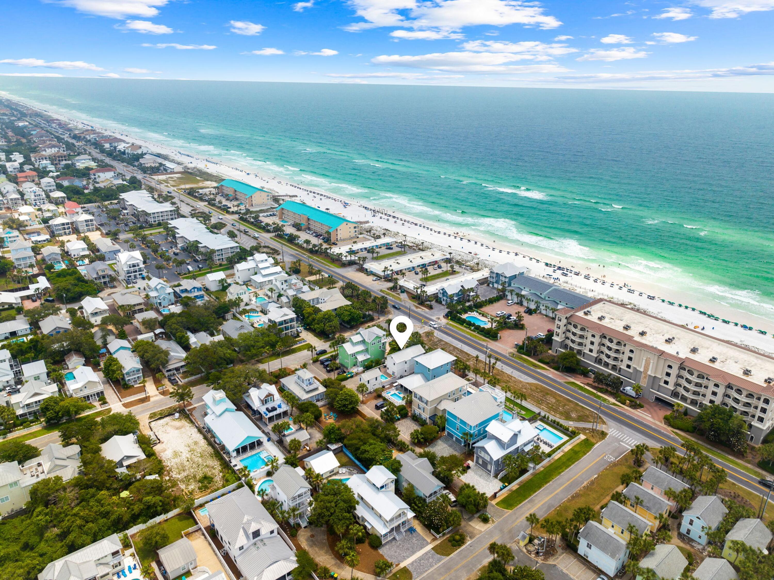 Nestled in the heart of Crystal Beach, this reimagined coastal retreat blends modern luxury, comfort, and an unbeatable location—just steps from the sugar-white sands of the Gulf. Extensively renovated, the home carries an effective year built of 2020, a detail that will positively impact insurance premiums.

The property features a two-story main residence plus a private carriage house, each with its own en suite and secured entry. With five bedrooms, 5.5 baths, and no HOA, it's ideal as both a luxury vacation getaway and a high-performing rental investment. Inside, every detail reflects quality craftsmanshipfrom impact-rated windows and doors to the light-filled, open-concept layout. The chef's kitchen is a showpiece with custom white cabinetry, natural wood shelving, a spacious island, and stainless steel appliances. Wood-look tile flows throughout the main level, which also offers a stylish living area with an inset fireplace, a generous dining space for entertaining, and a serene guest suite.

Upstairs, the king master retreat impresses with a spa-inspired bath featuring a frameless glass shower and dual vanity, while a large bunk room provides extra accommodations. Step onto the elevated deck to take in views over the private poolperfect for lounging, grilling, and soaking up the Florida sunshine.

The carriage house enhances flexibility with two additional private suites, each with an en suite bath. The lower level includes a secondary laundry, while the upstairs suite is complete with a kitchenetteideal for a quick breakfast before heading to the beach.

Just one row back from the Gulf, this property offers unmatched access to pristine beaches, championship golf, Henderson Beach State Park, Destin Commons, and top-rated dining. With gross rental income exceeding $165,000 in 2024 and projections over $189,000 in 2025, this turn-key retreat is more than a dream beach homeit's a proven investment opportunity.
