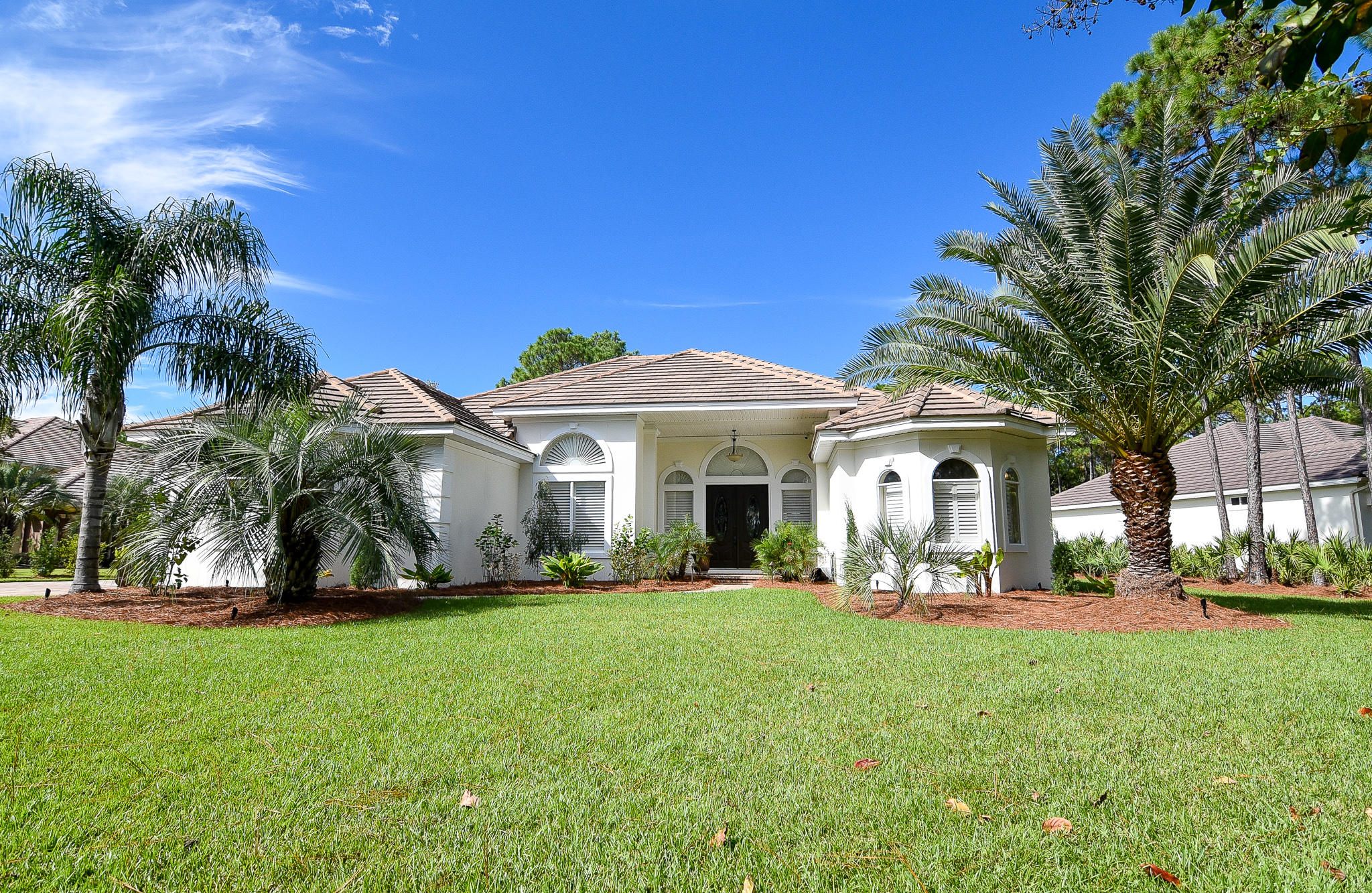 This beautiful Mediterranean style home is literally, better than new! In the prestigious gated 525 acre community of Regatta Bay with it's Robert Walker designed 18 hole golf course and club, the community borders the bay and captures the essence of the good life on the Emerald Coast. The owners have spent over $155,000 in the last two years perfecting what was already a spectacular residence. From the moment you lay eyes on this gorgeous home you will appreciate the top quality materials and workmanship in it's design and construction. Floors are of hand scraped hickory, porcelain tile and stone. Brick pavers cover the driveway and poolside patio surfaces. Beautiful granite abounds in the kitchen and baths and other surfaces. The view as you enter stretches across the home to the stunning pool and bubbling triple head fountain and waterfalls that grace the fully screened patio and outdoor kitchen. To one side of the home are the kitchen, dining room, office, family room, two guest bedrooms and full baths and the laundry room. The opposite side of the house is dedicated to the Master Bedroom and bath. The Master bedroom has a private exit to the pool and patio area. The kitchen features a hand hammered copper farm sink, beautiful custom cabinetry and top of the line appliances including a wine cooler. It is open to the Family room, Great room and the Dining room with its spectacular painted trey ceiling. Note that all doors are 8' in height and the ceilings range from 10' to 16' in height throughout. Plantation shutters have been installed on many windows and there is a whole home built in sound system. The beautiful back yard is completely enclosed in wrought iron look fencing and beyond is a wooded preserve area. There are raised beds for growing your own vegetables, herbs and flowers and there are a host of fruit trees for your enjoyment and of course a complete irrigation system for both the front and back yards. There is a whole home Generac emergency electrical system with a transferable extended warranty and maintenance agreement. Please note the tasteful landscape night lighting. The home is protected by a security system with remote access allowing control through a smart phone app. The windows have electronically controlled security and hurricane shutters as well. The garage has an extra tall ceiling so car lifts could be installed to store your collector cars. Please pay special attention to the documents section as there is a comprehensive listing of all improvements, and repairs including the source of the materials, costs and the contractors who performed the work related to each. There are more outstanding features to this home than those listed here. Please schedule a visit with your clients to see them all!