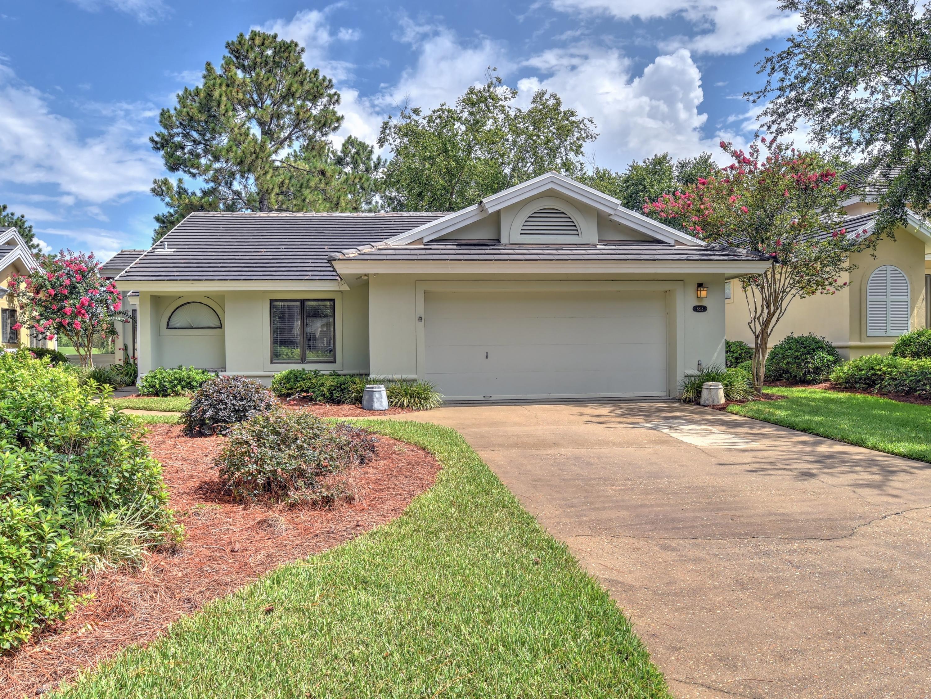 A rare find... 2 bedroom 2 bath home in the quaint subdivision of St. Andrews inside the guarded and gated Sandestin resort. This lovely home featuring a lake and a golf course view, in one of the most sought after communities. See this lovely home today and make St. Andrews within Sandestin your place to come home to. Very open floor plan with 2-car garage, vaulted ceilings, light and bright sunroom overlooking the lake and golf course. Fireplace in the living room. Wood floors throughout except for tile in the kitchen and both baths. Brick terrace just off the sunroom and master suite. Immediate occupancy. All room dimensions to be verified by buyer.