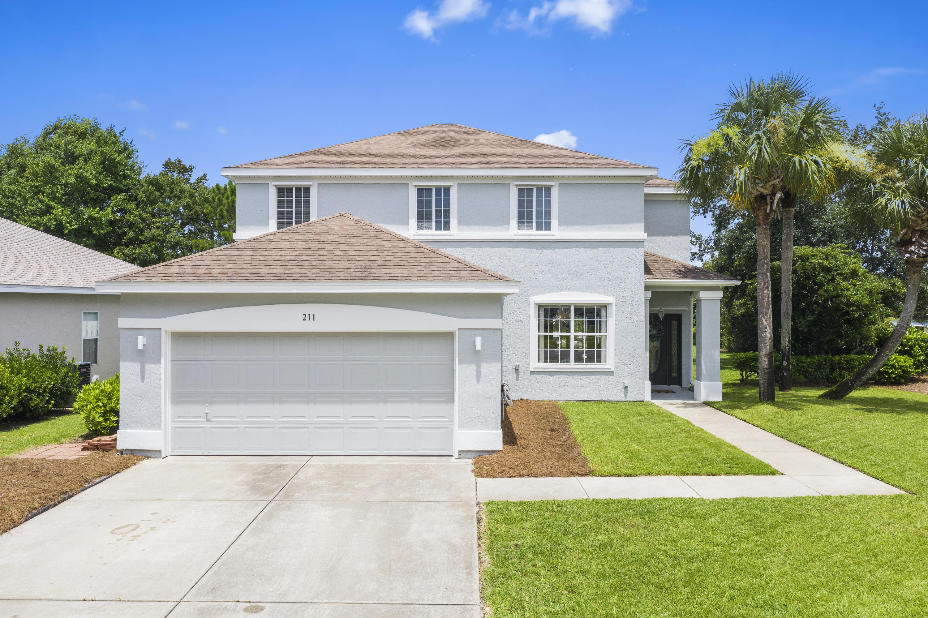 This spacious, two story Palmetto Trace home will provide plenty of living space for your family. The newly painted exterior and well manicured yard invite you into this impressive three bedroom, three full bath home. As you enter the front door you are welcomed into the living room and sitting area overlooking the front yard. The kitchen provides plenty of room for family gatherings with granite countertops, stainless steel appliances and a gas stove with convection oven. Just off the kitchen are two pantries with a laundry room. French doors off the living room and the dining area, provide easy access to the covered lanai and saltwater pool. Continuing on the first floor is a full bathroom and office which could easily be converted into a bunk room. The second floor has two large master suites, and third bedroom. The master suite boasts of his-and-hers walk-in closets, linen closet, two vanities, a jacuzzi tub and separate shower. The back of the property backs up to a conversation area and pond, which allows for additional privacy. 

Palmetto Trace is a quaint family-friendly neighborhood with sidewalks, two community pools, and street lamps. Conveniently  located next to Frank Brown Recreational Complex and Pier Park, and only 5 minutes to the beach! Palmetto Trace is a Non-Short Term Rental community. All info is approximate and must be verified by Buyers.