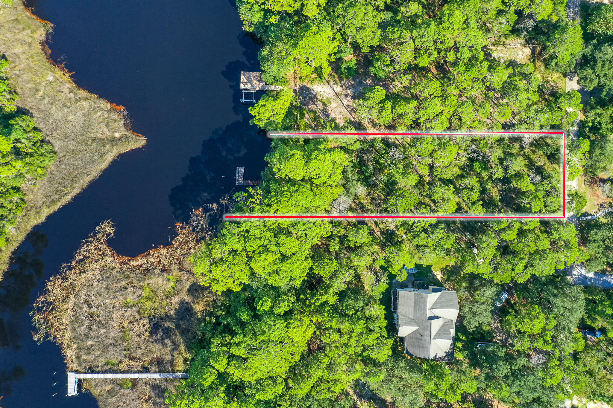 Peacefully nestled in this incredible location on beautiful Lake Powell in Inlet Beach. This property boasts a just over 1/4th acre lot (.464), with over 80' feet of lake frontage. With NO HOA, this property is the perfect opportunity for a primary residence, vacation rental, or second home! Build your dream home in the perfect location north of 98, but just a short walk to the beach, and a public access with lots of parking! Don't hesitate to request more information today!

Buyer to verify all information and dimensions. Information is deemed reliable but not guaranteed.