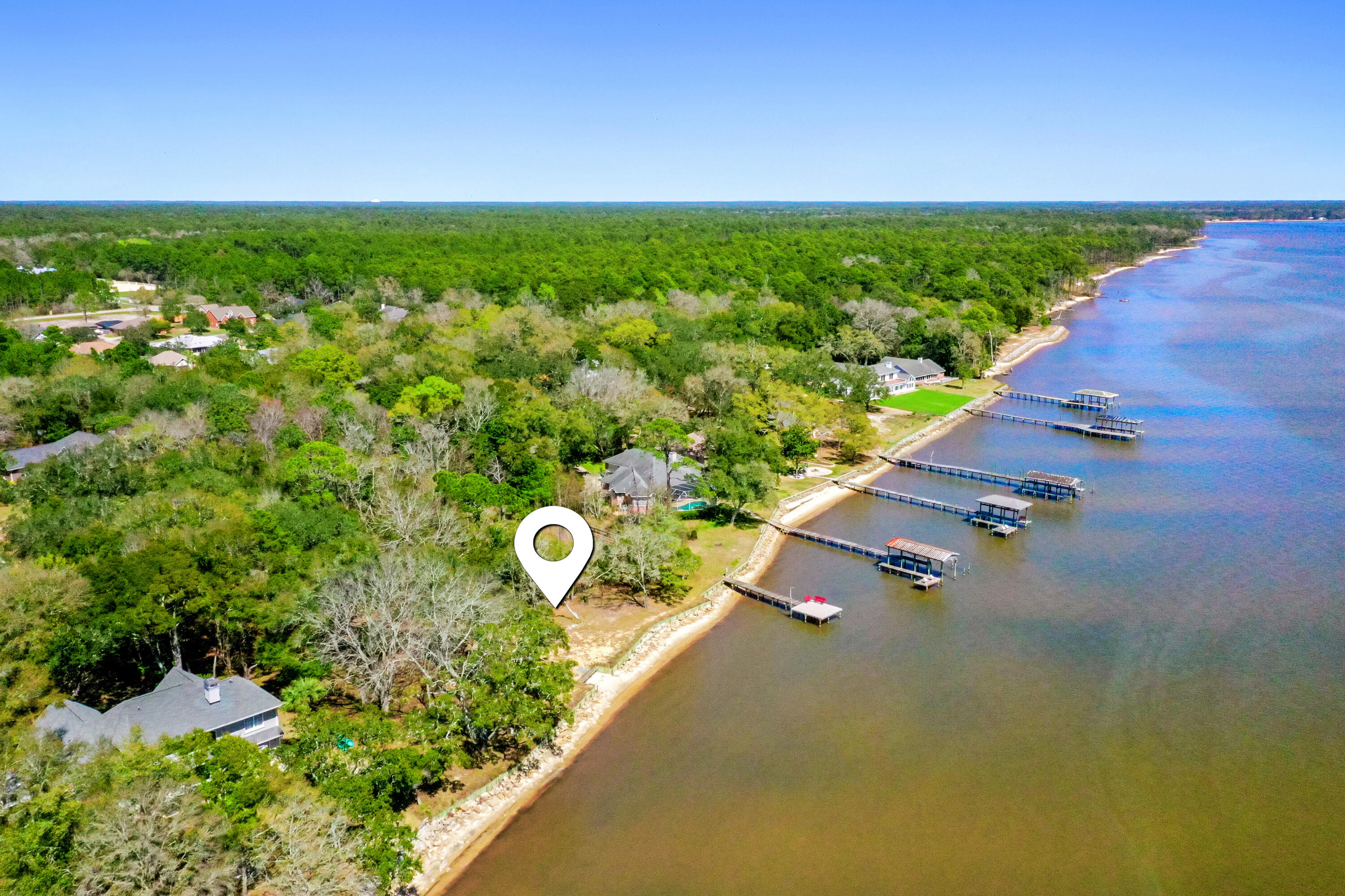 Welcome to your future home site! These beautiful vacant lots, 9 & 10, come with a combined 214 feet of serene waterfront on just under an acre, providing the perfect backdrop for your dream home. Recently bush hogged, the property features beautiful trees and a canvas for you to build upon.
Situated on a generous two parcels, this lot offers a unique blend of natural beauty and potential. A portion of the property includes a partial wetland, adding to the charm and ecological diversity of the landscape. Survey available.