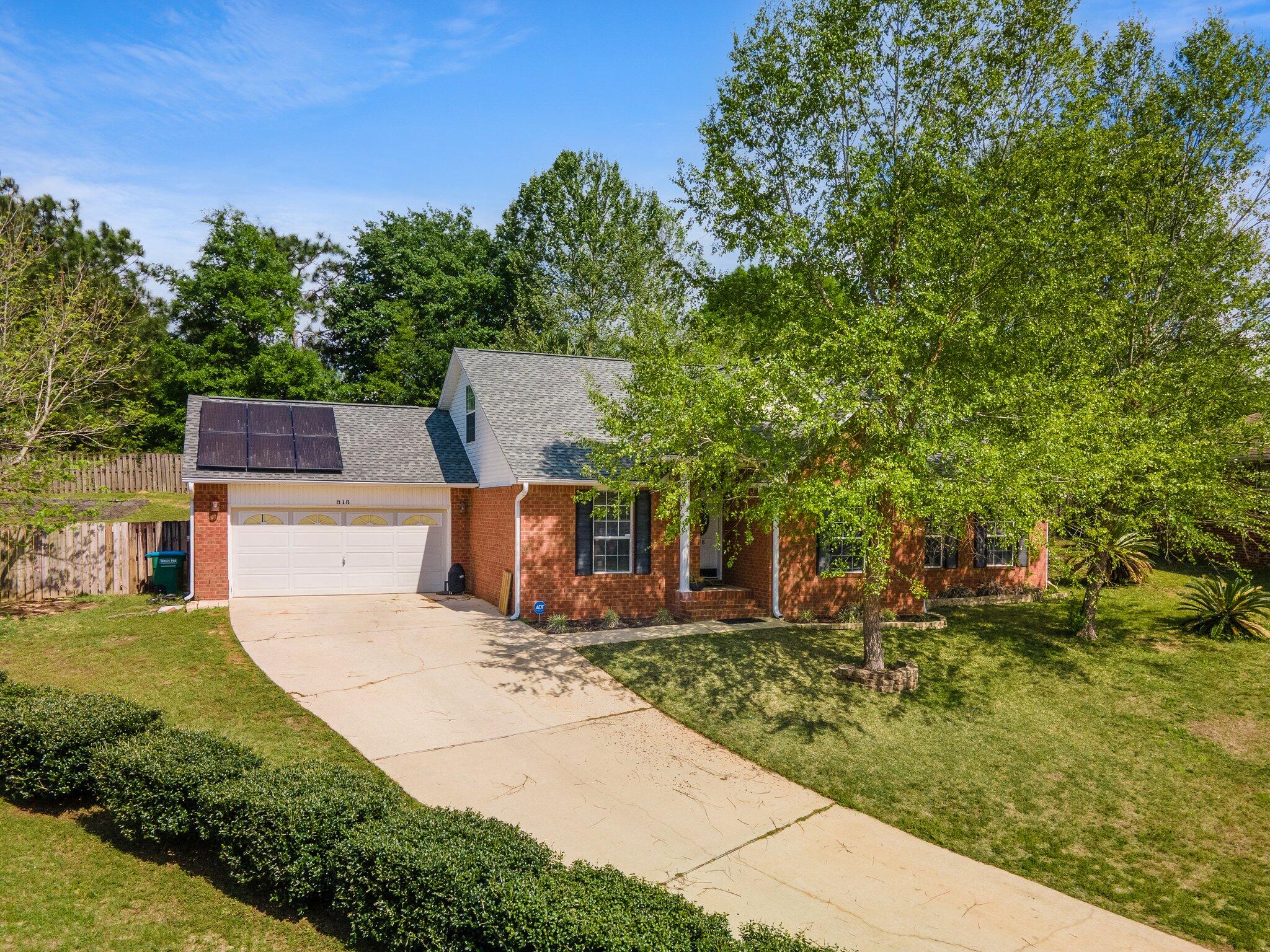 Fantastic 4 bedroom, 2.5 bath, 2-story brick home boasting over 2,200 sft & an easy commute to Eglin, Duke, Hurlburt Field, 7th Special Forces, beaches, schools, & more. The first floor features crown molding, recessed lighting, and other upgrades, as well as a spacious living room (with a fireplace) that leads out to a Florida room overlooking the large backyard with step garden. There is a lovely, upgraded, eat-in kitchen with a breakfast bar, granite counter tops, plenty of cabinet space, newer stainless appliances, a pantry, & a formal dining room. Also downstairs are a guest bedroom and half guest bath as well as the huge master bedroom with walk-in closet & a fabulous en suite, complete with double vanity, walk-in shower, soaking tub, & separate toilet room. Upstairs, two additional guest bedrooms share a full guest bath and there's a small space on the landing. The laundry room is off of the kitchen, and there is a 2-car garage, as well as a storage shed out back. HUGE LOT! Sellers to pay off solar loan at or before closing.  

-Roof/solar panels both 2020
-Water heater 2018 
-HVAC 2019