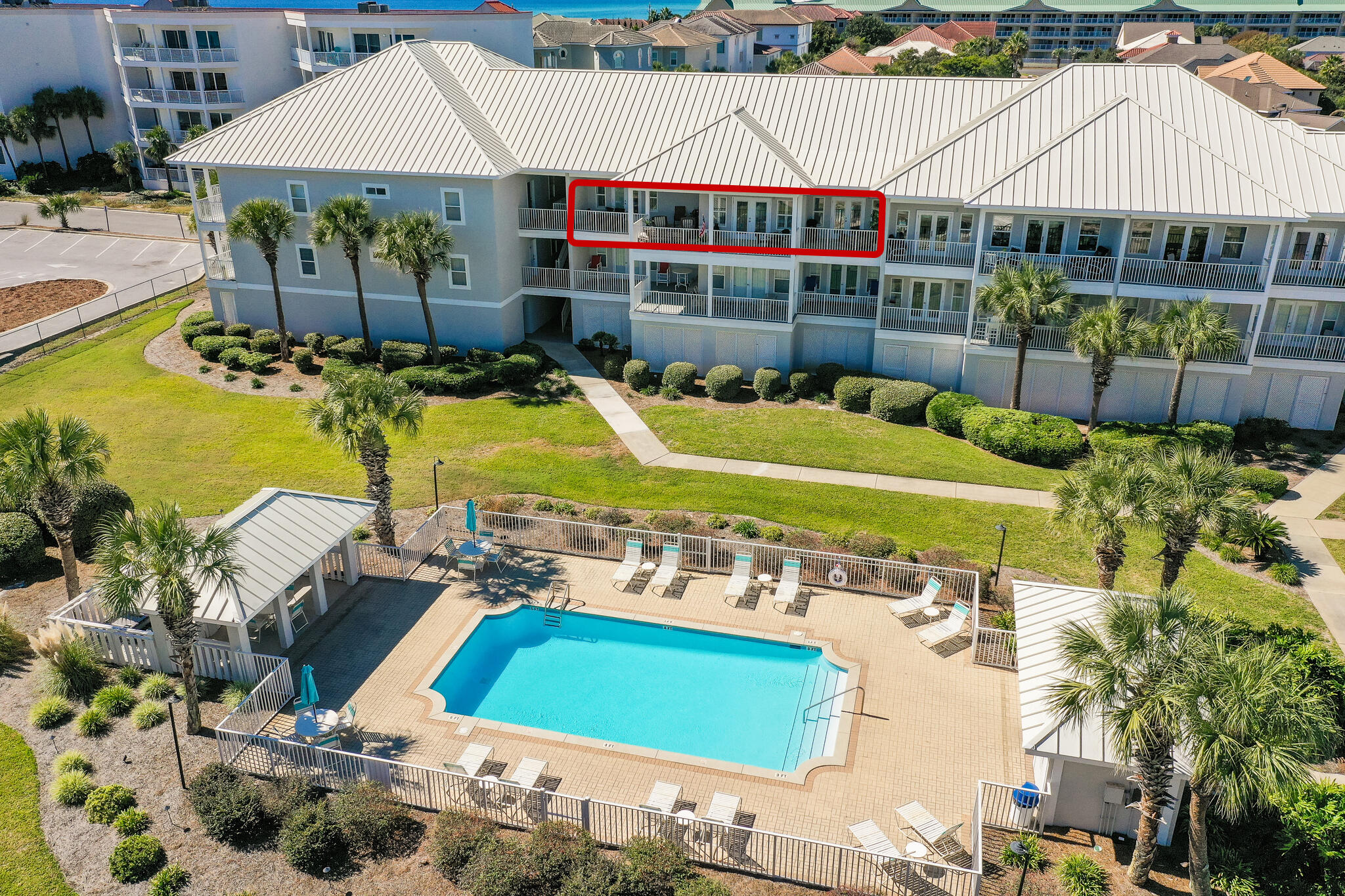 This is a gorgeous furnished 1563-square-foot luxury condominium directly across from the Gulf of Mexico's sugar-white sands and emerald-green waters. 
Located on the 3rd floor in the beautiful Pavilion Palms gated Community, it boasts professional decor and plenty of space to accommodate your family and friends. The open floor plan includes 10-foot ceilings, a spacious kitchen, granite countertops, and travertine flooring. There is plenty of seating in the living room with French Doors opening up to over 500sq/ft of terrace space overlooking the community pool area.

A spacious laundry room just off the kitchen accommodates a full-sized washer and dryer and provides easy clean-up after a day at the beach or lounging by the pool! There are two primary suites on opposite sides of the living room area, and both suites offer private access to the oversized terrace. The third bedroom is just off the main entrance and offers a spacious living area for any of your guests.
Imagine sipping your coffee from any one of the outdoor living spaces on the spacious balcony; as the sun rises, then spending the day frolicking along the seashore and toasting the sunset once the day is done. This family-friendly 30-unit condominium development will become your family's gathering place for weekends, holidays, and the summer. Or make this your full-time home in paradise. 
The condo offers a garage for plenty of storage and is large enough for parking two cars. In addition, the current owners have recently updated the HVAC system and have paid the special assessments making this the perfect turn-key opportunity.