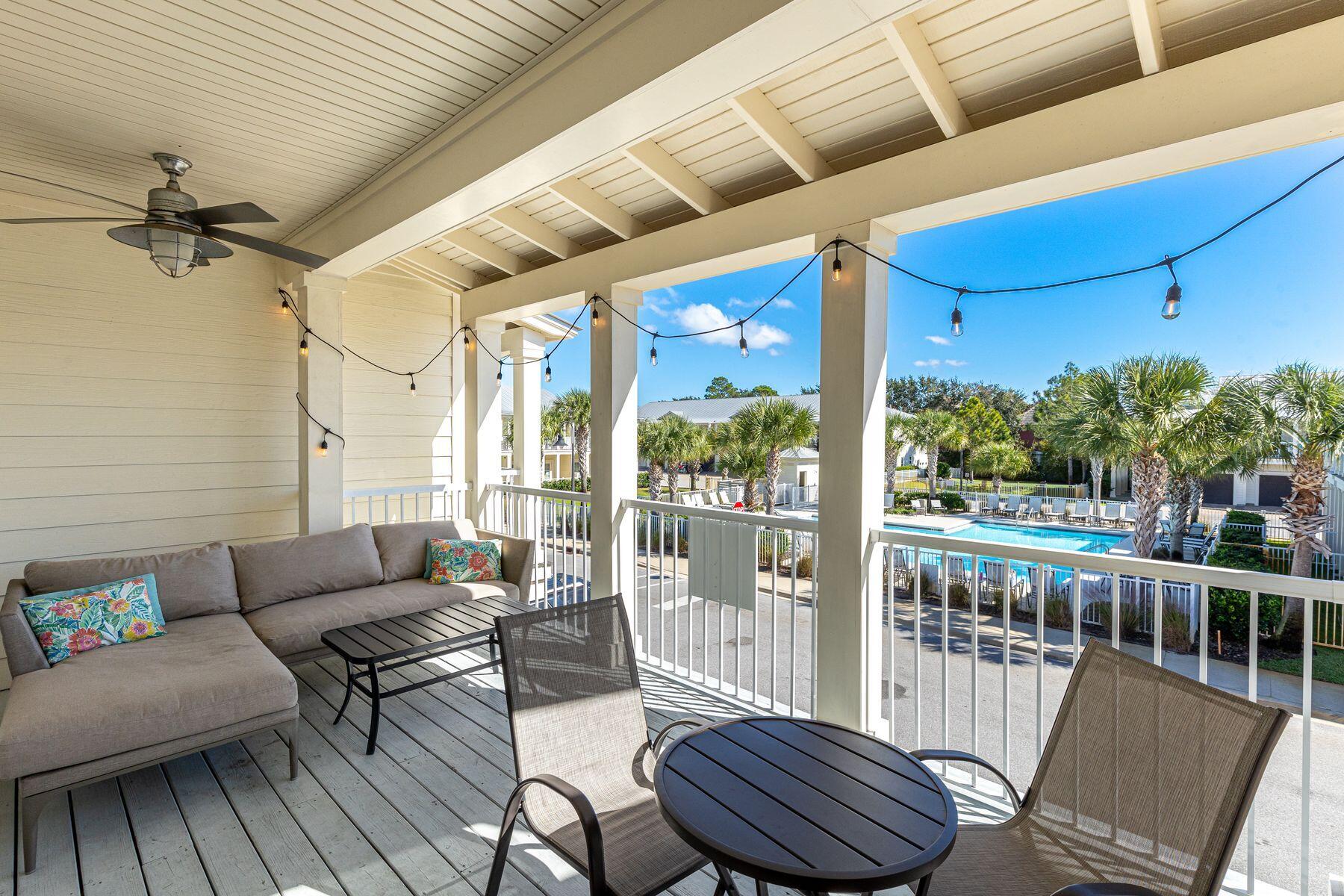 This attractive Destin townhome is ideally located—just three blocks from the beautiful beach and a stone's throw from local restaurants and activities. Boasting almost 2,000 square feet, this three-bed, two-and-a-half-bath home has a reverse floor plan. On the first floor, two large bedrooms and a shared bathroom comfortably accommodate family and friends. To the front of the property, you'll find paved parking for two vehicles and a single-car garage that provides storage for beach toys, bikes and paddleboards. A small porch covers the entrance door. The rear yard is a peaceful green space for barbecues, with a covered porch providing welcome shade. Head upstairs to the second-floor living space, where neutral wood laminate flooring and a shiplap wall complement the stylish plantation shutters, recessed lighting and coastal-inspired decor. The open floor plan flows naturally from the spacious sitting area through the formal dining space to the kitchen. Stainless steel appliances and granite countertops deliver a clean, fresh look to the well-appointed kitchen. A separate in-unit laundry room takes care of beach towels and additional storage. The second-floor master suite is at the rear of the property. It boasts a walk-in closet and a modern ensuite bathroom with a double vanity and a tiled shower-over-tub combo. The living room opens directly onto a generous 10-foot-deep balcony with pleasant views of the community pool. It's a delightful space for relaxing, reading and entertaining. As well as a pool, this friendly neighborhood has a dog park. Enjoy walking, riding a bike to Henderson Beach State Park or take advantage of the plethora of activities and restaurants that Destin has to offer. Big Kahuna's Water Park and the Destin Harbor are just some attractions nearby.