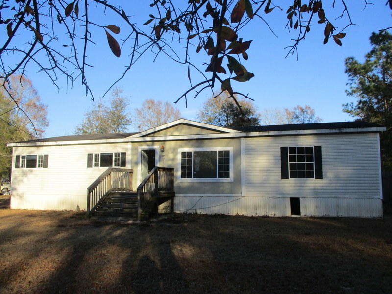 This HUD REO home is located just a few minutes off of the Hwy 87 I-10 exit making this one just a short drive from Downtown Milton, Navarre, or Pensacola. Built in 2007, this split bedroom design 3 bedroom 2 bath mobile home has vaulted ceilings, fireplace, kitchen island and tons of potential. A certain must see to appreciate. Call today to schedule your appointment. Property is FHA insurable (IE).