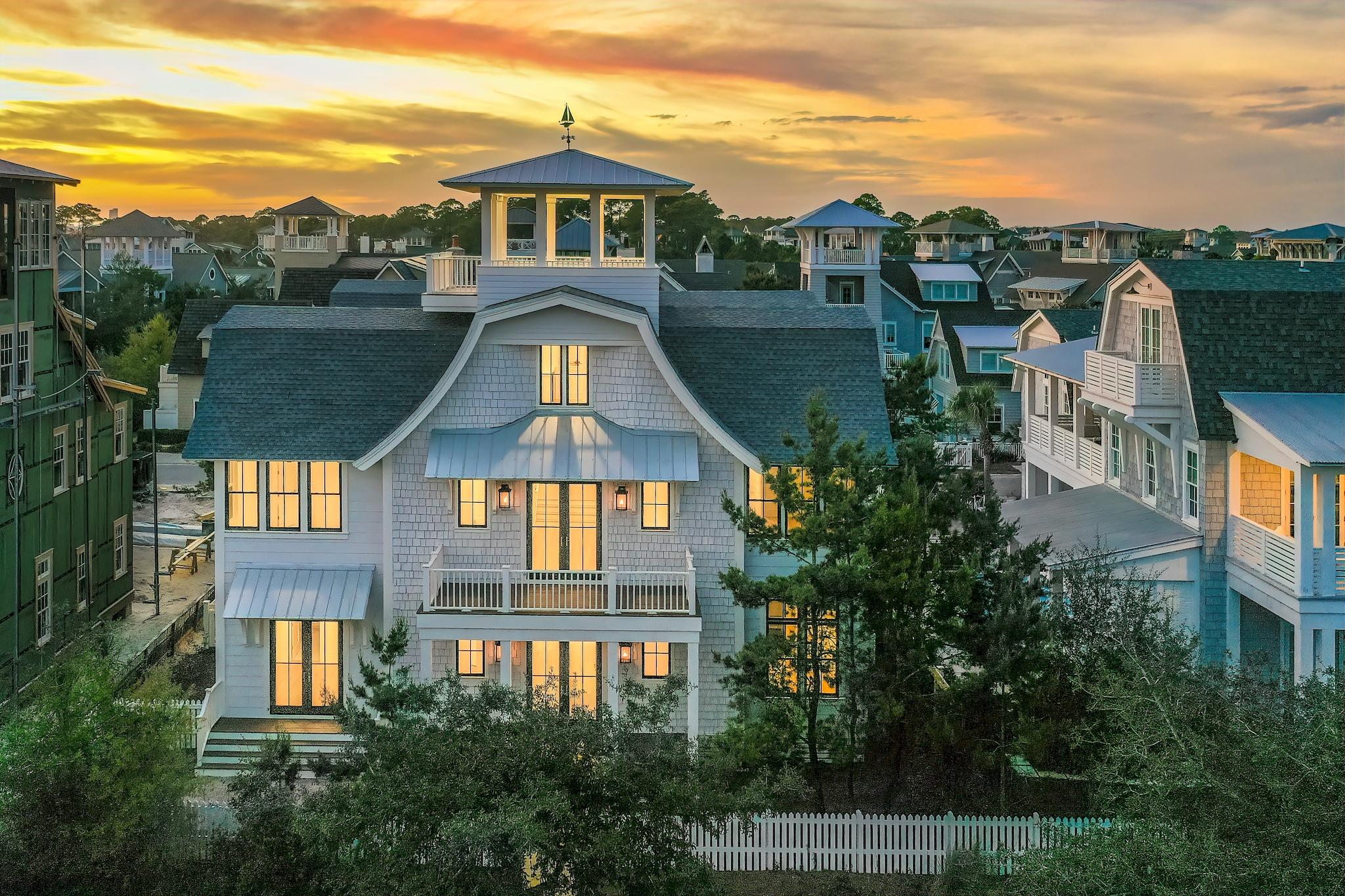 With park & Gulf views, this masterfully crafted estate-sized residence is truly one-of-a-kind and set atop a ''founders' lot'' in picturesque WaterSound Beach. Newly completed, this home blends timeless, traditional design with modern finishes, comfortable spaces with seamless indoor/outdoor living, privacy and the most incredible vistas.
The pinnacle of WaterSound Beach, the opulent estate is set at the edge of the expansive green space and steps from the Coastal Dune walkovers to the private beaches. This property offers serenity and privacy, but only minutes to shopping, dining in Rosemary Beach & Seaside, and a short drive to Northwest Florida Beaches International Airport. The home offers 6-bedroom, 7.5 bath, and is complete with three master suites, private elevator, carriage house, private pool & 2-car garage, liberal guest parking, and over 1,500 sqft of porch space for enjoying the true Florida lifestyle. Graced with classic, craftsman charm, mindful scale, a thoughtful floor plan, beamed ceilings, stunning use of materials and custom tile throughout. 

 

Upon arrival, under the soft glow of gas lanterns encamping the exterior of the home, guests are ushered through the front door & greeted by the commanding entryway. Boasting soaring 12-foot ceilings, there is a seamless flow through all spaces of the property. Every step through the residence highlights hardwoods, modern, and coastal finishes, including tongue and groove walls throughout the home. The great room is anchored by a gas fireplace and flanked by a wall of windows, ushering in natural light, offering access to the private courtyard pool & hot tub with surrounding private patio area.  An epicurean's dream, the kitchen boasts an oversized island topped with stunning Calcutta Vicenza Quartz countertops, a suite of Wolf & Subzero appliances, including dual dishwashers and two pantries for additional storage. A master retreat with lovely park views, spa-like bath, private sitting area and access to the courtyard complete the first floor.

 

Secondary guest suites offer private rooms with lofty ceilings, bright, natural lit rooms and spa-like en-suites. The 2nd-floor porch encourages relaxing on endless summer days while gazing down to watch dogs romp and play in the park, as bikers cruise down the pathway towards the white sandy beaches. The upper living area boasts 17-foot barrel-ceilings, providing the ideal space for the addition of custom bunks, creating the ultimate bunk room.  Enjoy a mixed drink or glass of wine and ascend to the tower where an oversized deck awaits with stunning Gulf views.  A private walkway from the main house allows access to the one-bedroom carriage. Just below, the oversized 2-car garage allows for the installation of a car-lift for the car aficionado in your life. Unrivaled quality, elegance, privacy and space are at the heart of this once in a lifetime opportunity in WaterSound Beach.