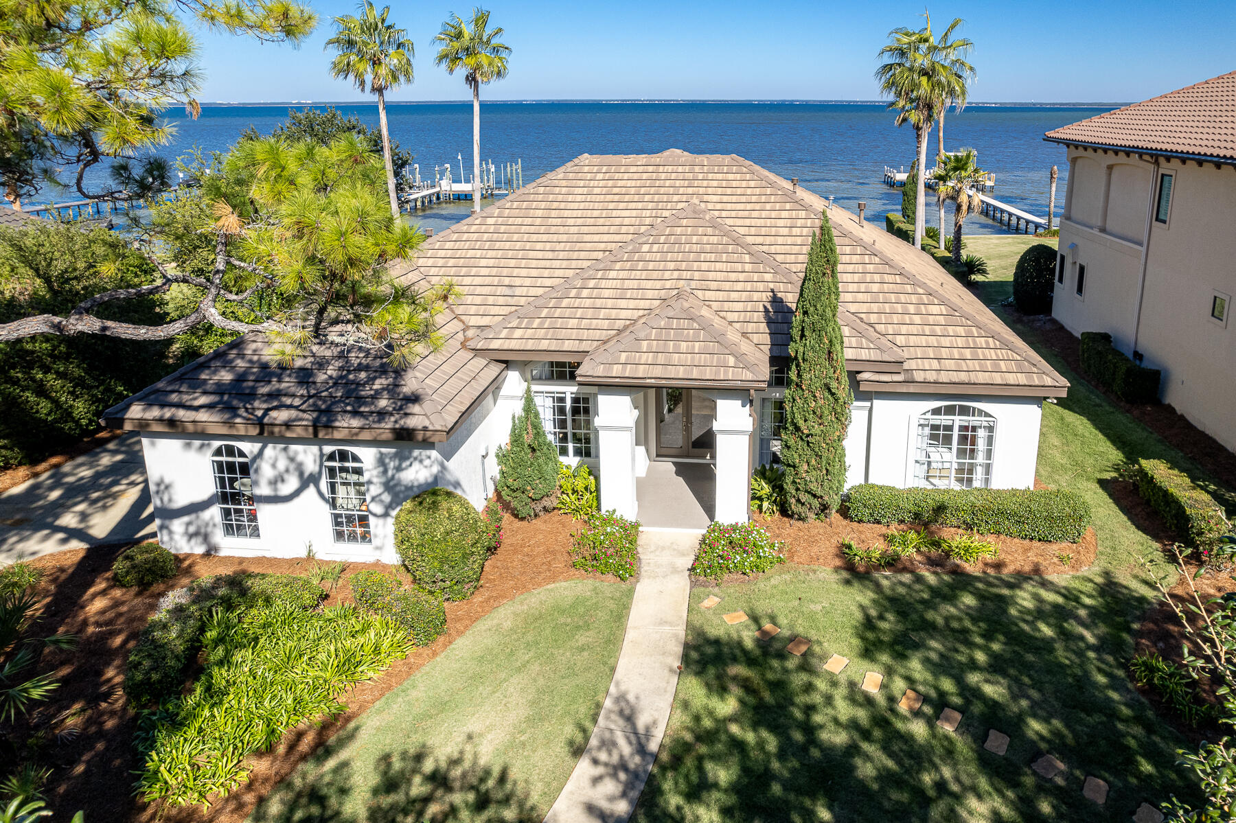 JUST REDUCED! REMODELED & FURNISHED Bayfront Home located in the exclusive community of Kelly Plantation in Destin, Florida! Measuring approximately 2,910 square feet of conditioned space and containing (5)-bedrooms and (3)-baths, this home will accommodate you and your guests as a wonderful primary homestead, or perhaps a secondary home to enjoy peace and serenity. Its lushly landscaped lot expands approximately 102' along the scenic bay shores of the Choctawhatchee Bay, while the estate-sized lot contains nearly a quarter of an acre. The dock and lift will accommodate various boating vessels and jet skis, and is in proximity to the famous Crab Island at the East Pass, which connects the bay to the Gulf of Mexico. Coupled with the spectacular amenities within the gated community of... Kelly Plantation this waterfront enclave will offer you and your family an opportunity to enjoy a phenomenal coastal lifestyle indicative of the Emerald Coast of Florida. The adjacent home located at 4500 Bellbouy Landing (MLS 935255) is also offered for sale, thus providing a rare opportunity to secure a family compound, providing the utmost privacy for family and guests. Enjoy the waterfront lifestyle on the Emerald Coast in Kelly Plantation of Destin, Florida! The incredible white sand beaches, restaurants, shopping, venues, and Destin Airport are only a short car ride away! Please inquire for further details and to coordinate your private showing today.