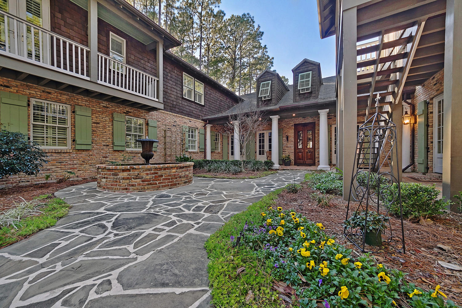 This one of a kind amazing New Orleans style majestic estate sits on the Choctawhatchee Bay on 1.1 acres and faces due west to capture breath taking sunsets. The 6,241 sq ft home features old Chicago brick walls and floors, antique doors and copper gutters. The long circular drive leads you to a charming courtyard that is ringed with balconies. Stroll past the gold fish pond to the dramatic front entrance. The master suite on the first floor, with it's own sitting room, offers stunning Bay views with soaring beams and trayed ceiling. The master bath even has it's own private garden. Entertaining will be a breeze in your gourmet kitchen with upscale appliances. Upstairs features two large bedrooms, media room and a bonus room. Guest house has two bedrooms. The separate carriage  house features an efficiency apartment, additional bedroom  and a  spacious office. The backyard features a huge 20x40  pool surrounded by Tennessee bluestone and there is a summer kitchen that has everything you need for your outdoor entertaining. Stroll down to the Bay to your private dock with covered boat lift. This home abounds with unique quality features like Brazilian Cherry wood floors, Fine Arts Chandeliers, slate-like shingles, Pella doors and windows, sound and high speed internet wiring, butler's pantry, smart room, whole house Culligan water softening system and three garages with custom mahogany doors. Buyer to verify all dimensions.