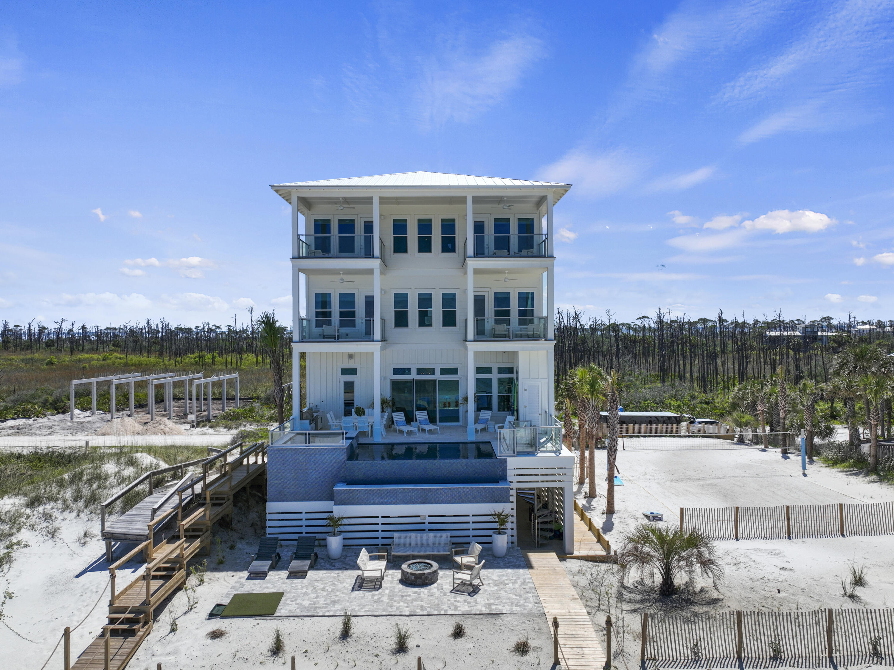 Seller Financing Available! Welcome to 'Making Memories on the Cape'. Prominently placed in the gated luxury community of Secluded Dunes, this home is perched at 30 feet above sea level encompassing 56.8 feet of gulf frontage. This home offers resort-style amenities, breathtaking views and finishes, commercial quality construction by a respected and local builder, and is made all the more sublime by the architectural design of a 30A architect. Boasting 9 beds, 9 full and 2 half baths, this home is equipped to sleep up to 28 people, making this a great option for those with large families and for those seeking ROI. Completed at the end of 2021, this architectural masterpiece rivals all homes along the Emerald Coast, yet provides the tranquility and the serenity we long for! INVESTMENT ALER This property is on track to gross over $500k in revenues for 2024! Equating for 4 weeks of owner usage (40k income plus), this home realizes a 6% CAP Rate, which is nearly impossible for a waterfront home anywhere along the Florida Panhandle! Look for the proforma in the docs section of the listing. Here is a link to a virtual tour of this amazing property: Video:https://youtu.be/9cUjHADrHpI