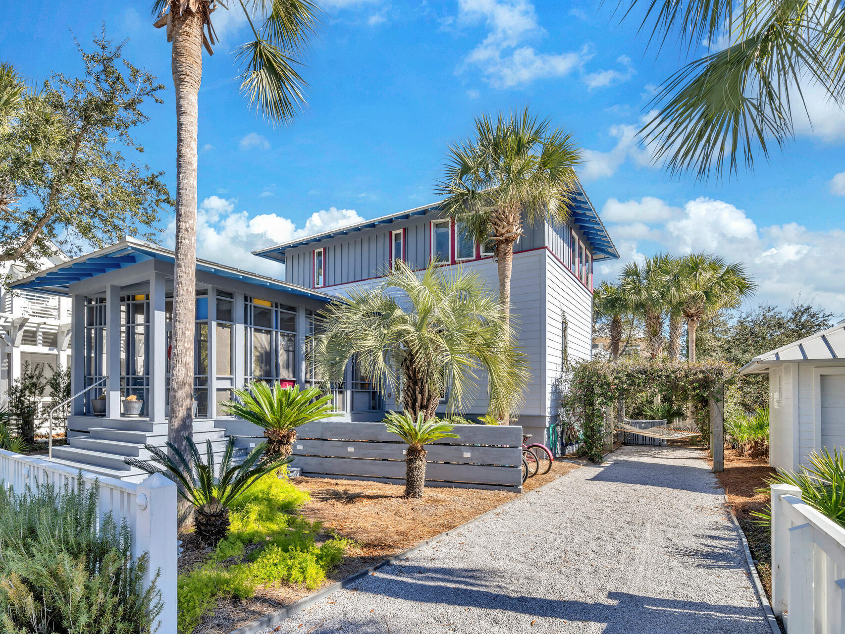 Home is located in the Gulf Front Community of Carillon Beach, All the homes are on the Gulf Side of highway. The Home was featured in Cottage Living Magazine April 2006. Designed by architect Gary Justiss. This modern upbeat cottage is overflowing with vibrant colors and eclectic fun furniture. The master bedroom offers a separate office/artist area.
Renters agree the front screened room is the favorite. The house is rental ready with several weeks already commited.