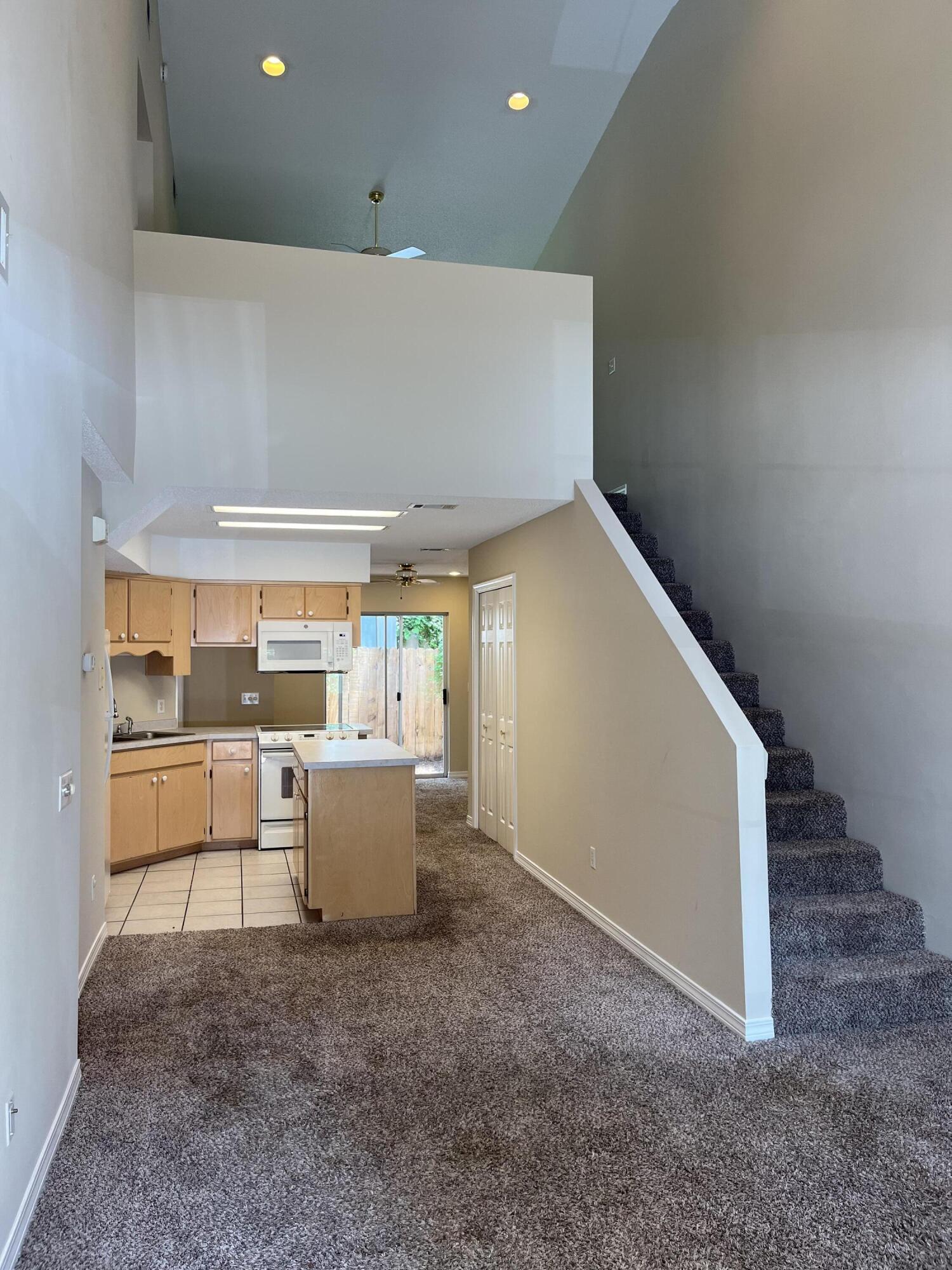 Great location, very convenient to both bases, shopping and dining. Townhouse located in Wilson Square neighborhood off of Hurlburt Rd. Downstairs you have a VERY HIGH vaulted ceiling in the living room, master bedroom with his and hers closets and a private vanity, an attached full bath, great kitchen with island, dining room, washer and dryer, and a garage with workbench. Upstairs you'll find a fantastic loft, two good sized bedrooms, and another full bath. The private backyard is fully fenced. NEW INTERIOR PAINT, NEW GARAGE DOOR OPENER, NEW ROOF, all of the rooms have ceiling fans and most have recessed can lighting. All of the upstairs windows have hurricane shutters. Call today to see this move in ready property!