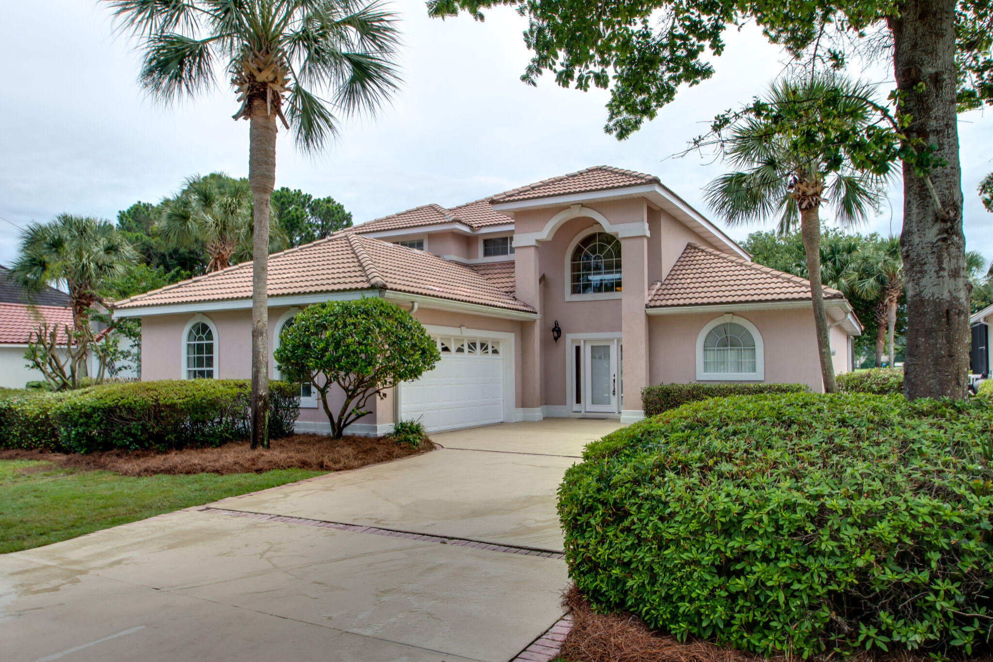 Beautiful home with heated gunite pool, oversized lanai, and gorgeous views overlooking Emerald Bay's 18th fairway. As you enter you will be in a tall foyer leading to an open floor plan with hardwood flooring, Eighteen foot ceilings, and an excellent light level with lots of windows'. Click on the photos to discover the many upgrades the home has received. Some of the features include: The large great room with gas fireplace, stainless steel appliances, granite countertops, custom cabinets, and an oversized Master Bedroom with en-suite bath. The open room to the left of the hallway foyer has been used as an office and can also serve as a formal dining area. A media loft is located on the second level immediately to the left of the top of the stairway. Flex space on 2nd floor loft area can be media/gaming/office space and looks over the living room while opening up to 2 guest rooms and  Screened in lanai features pool and hot tub also accessible from master bedroom on 1st floor.