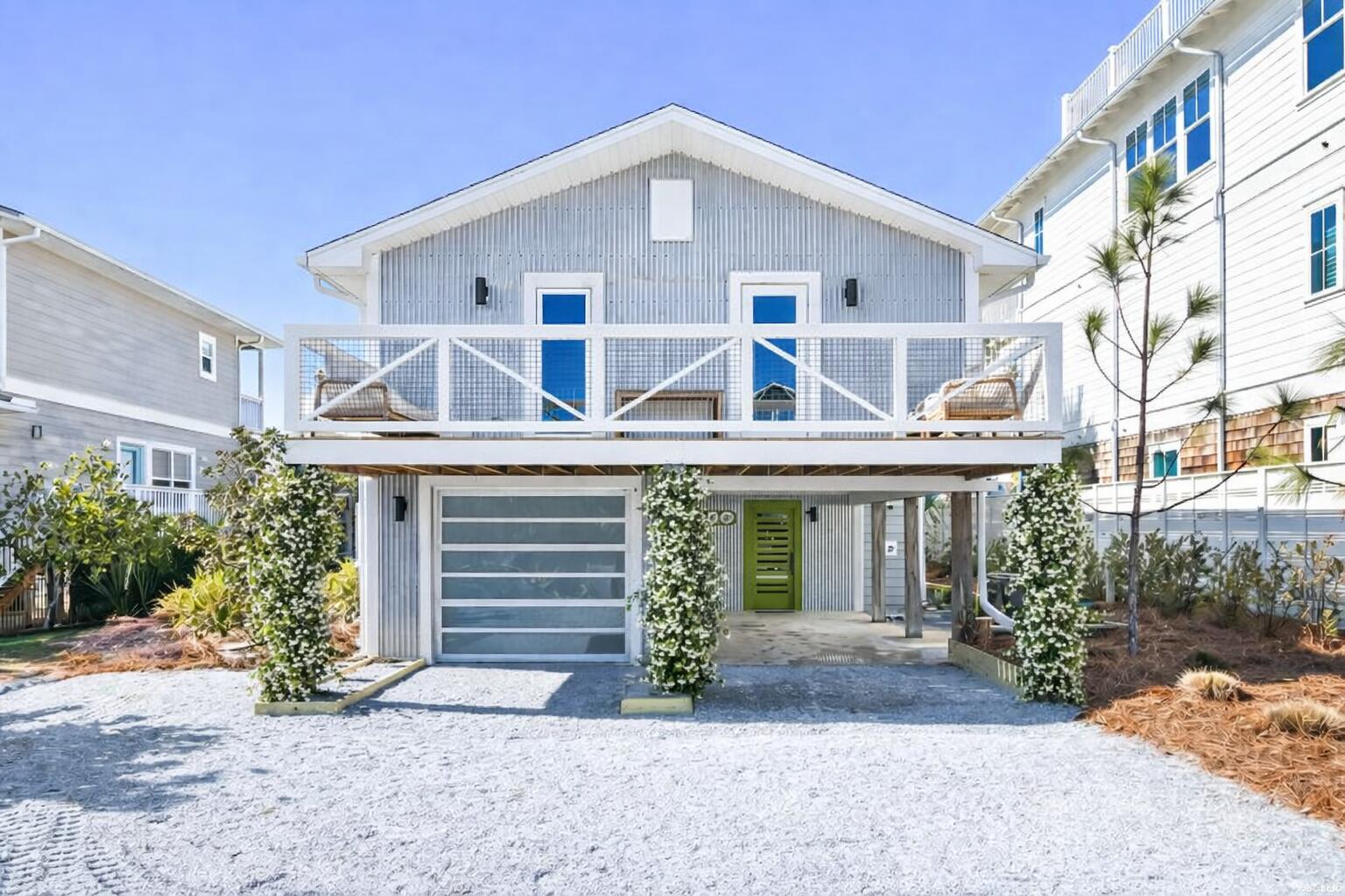 Welcome to 186 Magnolia Street - Where Old Grayton Soul Meets Refined Coastal Design - a completely reimagined coastal retreat that captures the quintessential Old Grayton Beach vibe-retro, relaxed, and effortlessly cool-this property is designed to entertain, built to endure and be coveted by guests and is just a short walk to two beach accesses. This stunning 4-bedroom, 4.5-bath home has been fully remodeled from top to bottom, blending vintage surf-style charm with modern luxury and high-end finishes throughout. The property offers exceptional parking with a garage featuring an epoxy floor, an additional carport, and a large driveway accommodating up to seven vehicles. The first level welcomes you with wood-planked tile flooring, a comfortable sitting area, and an inviting living space complete with a wet bar, ice maker, wine refrigerator, and a striking custom tile accent wall. A first-floor primary suite features an ensuite bath with a soaking tub and custom tile work. A stylish half bath with shiplap accents completes the interior. Step outside to the expansive first-floor deck, showcasing a large, heated pool with a chair deck, an herb garden with pergola, and space designed for outdoor living. (A paver walkway and pool deck are currently being completed.) The second and third levels feature beautiful oak wood flooring throughout. The second level offers a light-filled sitting area, dining space, and living room with a gas fireplace. The galley-style kitchen is outfitted with Thermador appliances, quartz countertops, open shelving, and a breakfast bar-perfect for entertaining. A hallway leads to a guest bedroom with an ensuite bath and private balcony overlooking the front yard, a bunk room with two full-size bunks and a full bath, and a conveniently located laundry room. The third level is dedicated to a serene primary suite, complete with an ensuite bath featuring dual vanities and a custom-tiled shower. A private balcony offers beautiful Gulf views, creating the perfect escape. Major upgrades include all new impact-rated windows and doors, new wiring and plumbing, new tankless water heater, three new HVAC units, and a new 30-year architectural shingle roof-offering peace of mind and modern efficiency. 186 Magnolia Street is a rare opportunity to own a thoughtfully updated beach home that honors the timeless Grayton Beach aesthetic while delivering today's comforts-all in one of the area's most beloved locations. Grayton Beach is beloved for its eclectic, retro surf culture, tree-lined streets, and an atmosphere that feels authentically coastal. Home to Grayton Beach State Park, world-class dining, and a strong sense of community, this is one of 30A's most sought-after and enduring neighborhoods. Whether envisioned as a refined personal escape, a legacy beach home, or a property with strong rental appeal thanks to its layout, amenities, and premier location, 186 Magnolia Street represents a rare opportunity to own a true Grayton Beach classic-elevated, effortless, and undeniably timeless. This is more than a beach house; this is a Grayton Beach Statement! Now is your chance to live the Grayton Beach Life-Artful, Authentic, and Unmatched!