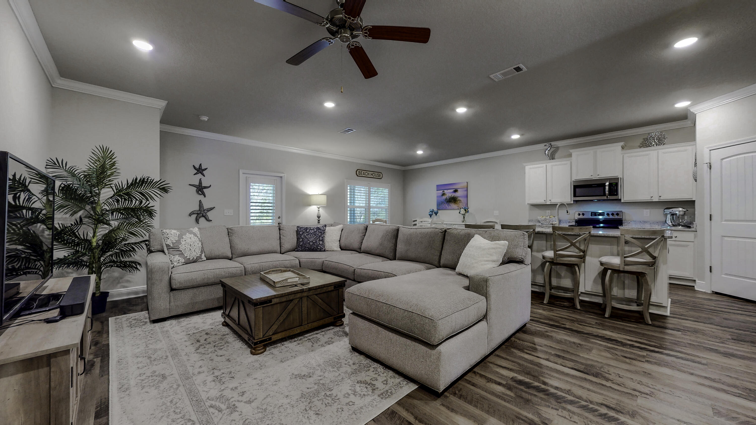 Cozy looking on the outside but roomy on the inside! 2049 sq. feet of gracious living space and wonderful upgrades including a screened rear patio, rain gutters and plantation shutters throughout. The large garage even has it's own separate heating and cooling system! There is plenty of room to entertain or just kick back and enjoy the space. The kitchen, living room and dining area are all open to each other and the kitchen has lots of storage, cooking and food prep space, plus a large walk in pantry. The split floor plan affords plenty of privacy to the four bedrooms. The master suite features a luxurious bathroom. A second full bathroom is centrally located to serve the rest of the home. LTV flooring throughout, no carpeting. Outside, the rear of the large back yard is bordered by forest. The property has a complete irrigation system and landscaping. Close to shopping, dining, assorted services and Sacred Heart hospital as well as the Choctawhatchee Bay and the beautiful beaches of the Emerald Coast, this home is waiting for you!