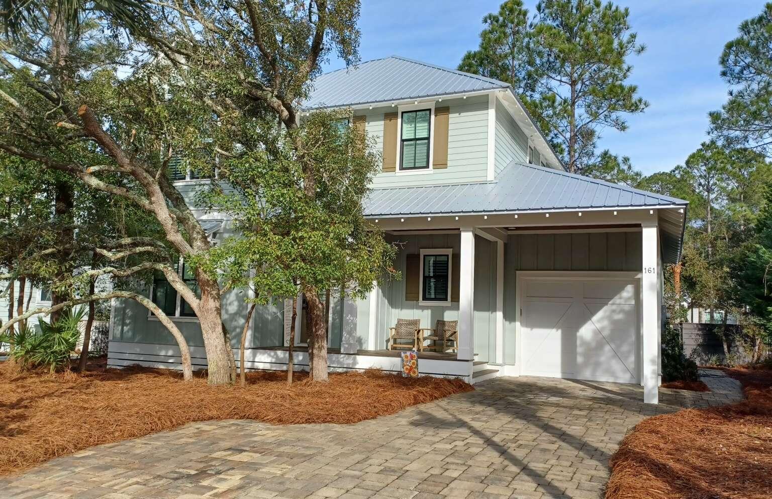 Offered partially furnished. With a mix of private comfort inside and immediate access to a variety of natural wonders outside, 161 Lakewood Drive is ideal as either a primary home or vacation/rental home. Located in Seagrove Beach's Eastern Lake community south of 30A, this beautiful custom home is uniquely situated to provide access to all the outdoor activities that South Walton has to offer! For kayakers a hidden-gem public park with boat-launch into Eastern Lake, one of the Emerald Coast's famous Dune Lakes, is directly across the street. You can be in the water in minutes and enjoy paddling the lake with access to the public Gulf beach at the lake's kid-friendly inlet. If you prefer walking or riding to the beach, the nearest public beach is less than a half-mile down the street.  Whether walking or boating, there is easy public access to the pristine natural beauty of Deer Lake State Park, just to the East. And for hikers, Greenway Station is a quick walk to the West, allowing access to Point Washington State Forest and its extensive trail system. And with rear-facing screened porches on both levels and a stand of old-growth trees in the front yard, the home provides nature and seclusion--even in the midst of a vibrant neighborhood with conveniently-located community pool and nearby to dining and shops, including the Old Florida Fish House and Cafe Thirty-A. The home features 4 bedrooms including a spacious 2nd-floor master bedroom with gorgeous private bathroom and its own screened porch. A secondary master bedroom with private bath is located on the first floor. Two additional guest bedrooms with a shared hall-bath are found upstairs. The open kitchen features ample storage and counter space, meaning that there is always room for cooking a fine meal. A rear screened-porch can be accessed from the living space downstairs, and opens up to a patio perfect for stoking a fire pit. There is parking space for 4 full-size vehicles, including a 1-car garage and partial carport attached to the front porch. The expanded driveway allows for at least 2 vehicles to park without needing to shuffle for entry, and when entertaining the nearby Eastern Lake park provides opportunity for overflow parking across the street.