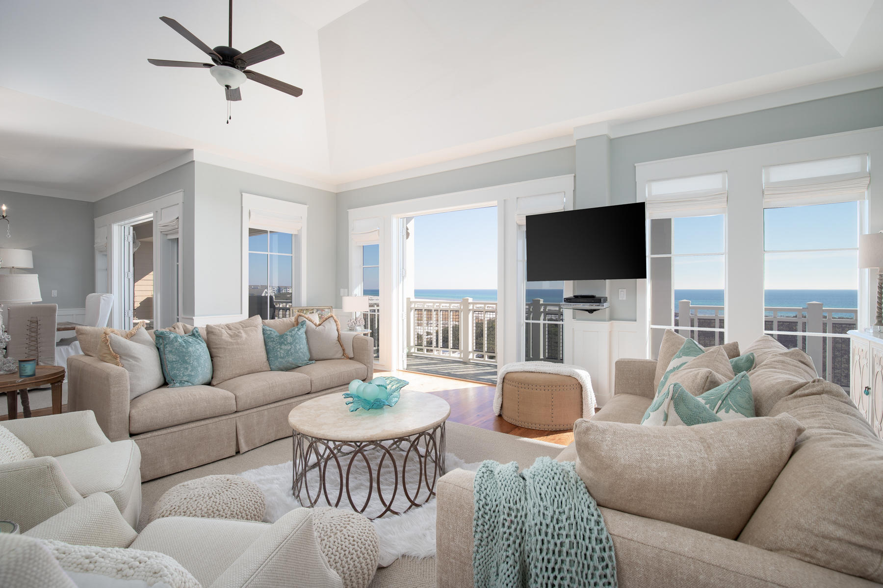 Luxurious top floor corner condo in sought-after Compass Point combining abundant space with a superb community lifestyle at WaterSound Beach. Gorgeously decorated with wainscot walls, newly updated lighting and gleaming wood flooring, this four-bedroom beach condo is the perfect place for spending peaceful days relaxing with friends or entertaining. Wind-sculpted dunes with waving sea grass are all that separate this stately condo from glittering gulf waters and the private white sandy beach. It's a world away from everyday stress and a rushed pace of life. Wake up to serene sea views from the large master bedroom and head out onto the private balcony for morning coffee and bagels. The generous wraparound porch is an inviting place for entertaining or spending quality time reading and relaxing. The comfortable living room is perfect for watching TV, if you're not mesmerized by the view framed by an abundance of windows and French doors. With an office nook, new window treatments and deep whirlpool tub, this condo ticks all the boxes as a stunning vacation home or full-time residence right on the beach. There's even a one-car garage with storage space for bikes and beach gear. You don't have to go far to find activities including golf, fishing and watersports. Boardwalks and bike trails provide access to green parks and fishing ponds and there's a state-of-the-art fitness center for workouts. Like the rest of Watersound's first class amenities, there are three beautiful swimming pools to choose from. Just minutes away, Deer Lake State Park offers nature at its best and there are a plethora of upscale boutiques and fine dining nearby. If you're looking for a beach property that exceeds all expectations, this condo at Compass Point has it all.