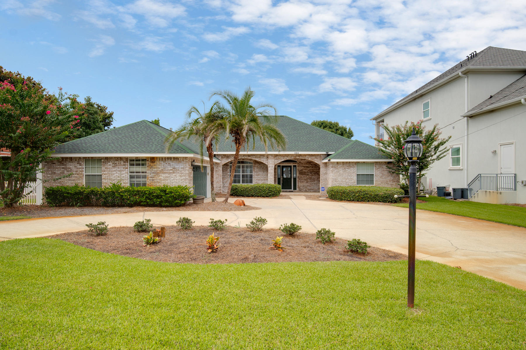 Gorgeous bay front home with amazing extras and upgrades! In 2017, all new stainless steel appliances were added including a double oven and gas cooktop. All kitchen cabinets were replaced and granite countertops were also added. In the great room, two new cabinets and granite counter tops were added along with a wine refrigerator. This area once contained a wet bar and the water hook-ups are still there. The Master Suite has amazing views of the sunrise over the bay. All new cabinets, fixtures, marble countertops and new tile in the shower and around the tub were recently added as well. The home features two other bedrooms which share a Jack-and-Jill bathroom, also with new cabinets, granite countertops, etc. Check out the photos and the list of improvements! One of the two additional bedrooms, features tons of built-ins including 2 desks and a queen size murphy bed. 

Outside you will find a heated pool, screened in lanai, 38-foot trek dock recently re-supported with new pilings, a boat house complete with water and electricity, a new sling-style boat lift and lifts for 2 jet skis.