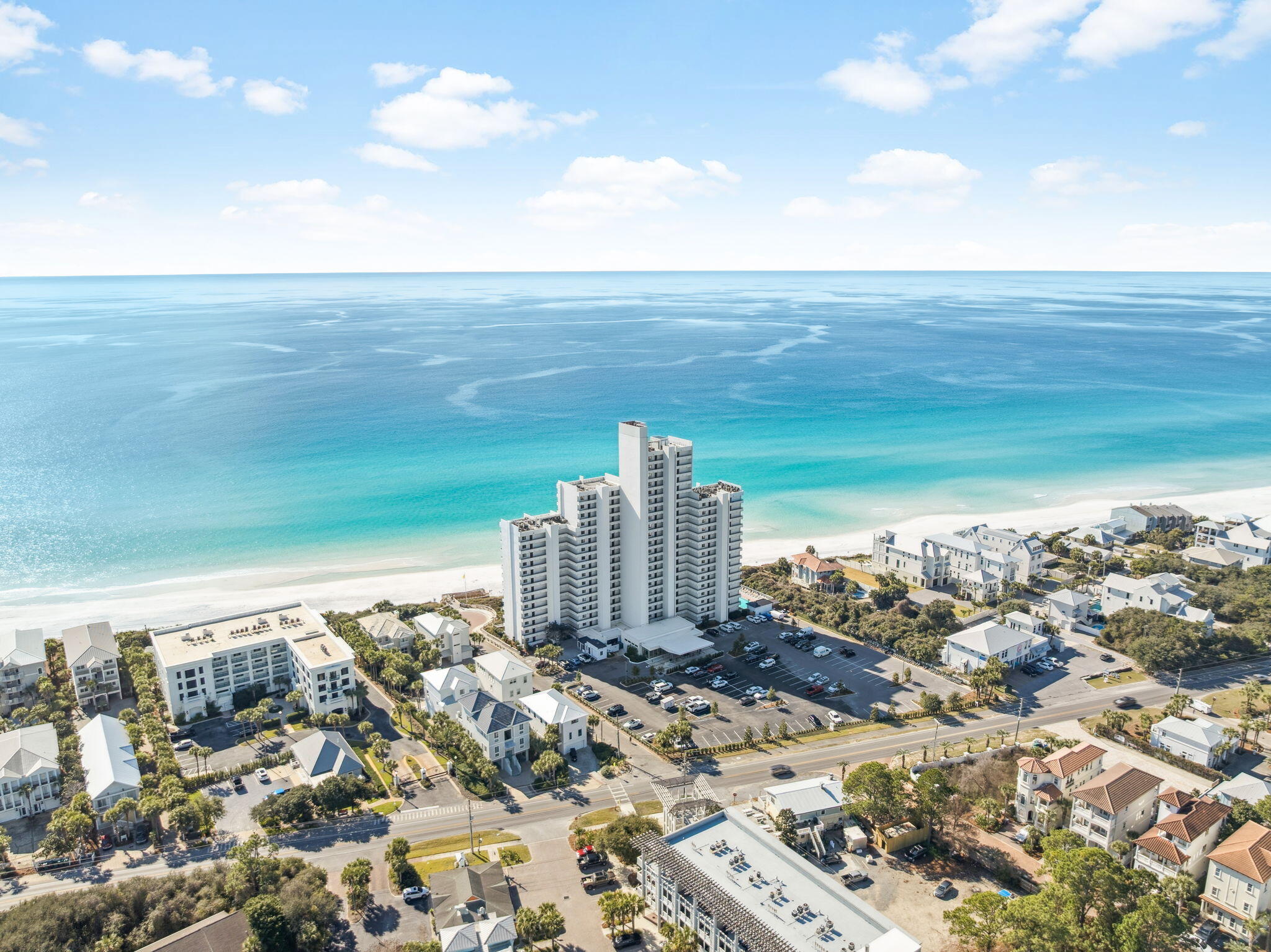 Experience breathtaking 16th-floor living at One Seagrove Place. Located in the heart of 30A, this 2-bedroom, 2-bathroom residence showcases spectacular direct Gulf views through expansive floor-to-ceiling sliding glass doors.

The open-concept living space seamlessly connects the living room, dining area, and kitchen, creating an ideal environment for both everyday living and entertaining. Natural light floods the residence through the wall of glass that opens to a generous private balcony overlooking the Gulf. The kitchen features wood cabinetry, stone backsplash, stainless steel appliances, and a breakfast bar with seating. Tile flooring throughout ensures easy coastal living and durability. The primary suite captures direct Gulf views and features sliding door access to the private balcony. The ensuite bathroom includes a walk-in glass-enclosed shower with custom mosaic tile accents, marble countertops, white cabinetry, and contemporary fixtures. The guest bedroom includes built-in storage cabinetry and a private bathroom.

Step onto your private Gulf-front balcony and take in the panoramic views stretching along the pristine coastlineperfect for morning coffee, sunset watching, and enjoying the coastal breeze.

One Seagrove Place offers resort-style amenities and direct Gulf-front positioning in the center of Seagrove Beach along Scenic Highway 30A. The secure building and 16th-floor elevation provide both privacy and unparalleled views of the emerald waters and sugar-white sand beaches. Do not miss this rare opportunity to begin living the 30A lifestyle.