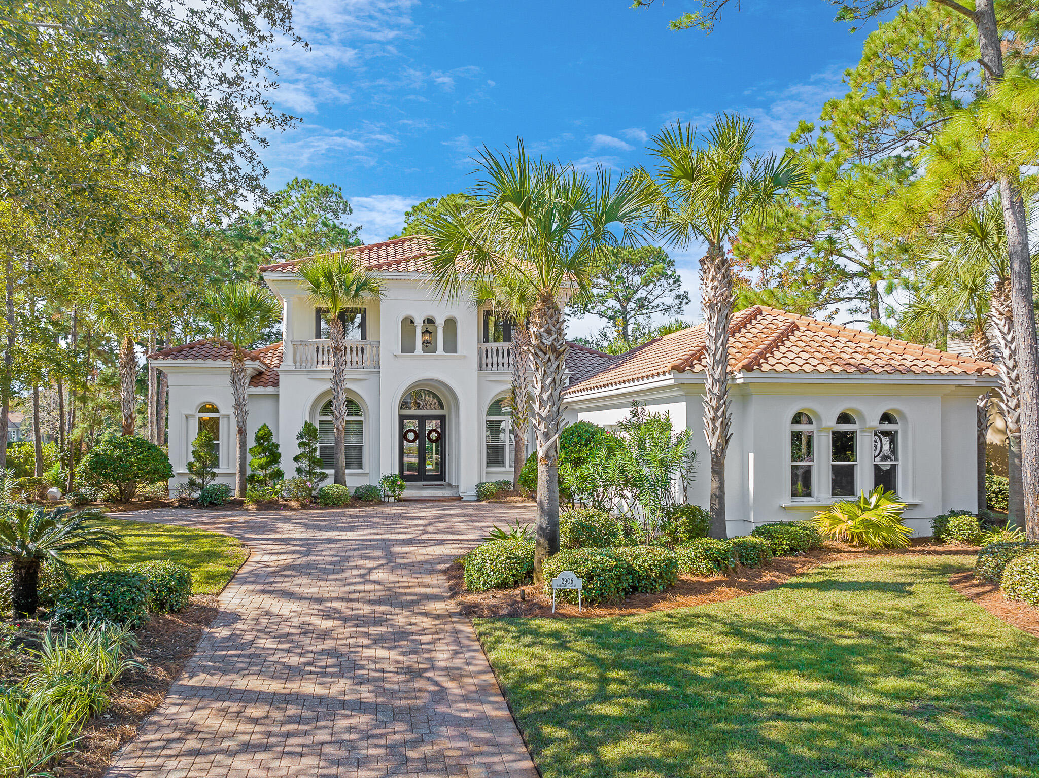 Renowned architect Arthur Rutenberg designed this custom coastal estate in Pine Valley nestled on the sixth hole of the Burnt Pine Golf Course offering scenic views with neatly appointed greens bordering the home's private pool and courtyard. 

Upon completion, this home was featured in Legendary Homes Magazine showcasing the innovative, stately design of this residence. Fresh paint inside and out reverberates the natural light that flows from the gorgeous entrance to the bank of sliding pocket glass doors to the outdoor living space.  All of which are classic details to a Rutenberg design, where the split floor plan has a centrally located large gourmet kitchen featuring double islands, luxury appliances flanked by wider hallways with great views throughout.

In addition to plenty of gathering space in the kitchen, there is an ample room for everyone.  The home features a formal living area, family room, formal dining room and breakfast nook adjacent to the pool area, spa and grill.

Private spaces located on ground level showcase a prominent, expansive Master suite as well as a guest bedroom suite. The Master Bath has double custom vanities, soaking tub and frameless walk-in shower.  The second level hosts two guest suites with guest baths with custom cabinetry, frameless showers and unique fixtures. The second level also offers a quaint study and a vast secondary living space that is perfect as a game room or family room overlooking the immaculate golf course views.

Burnt Pine is situated in the Sandestin Golf and Beach Resort that features more than seven miles of beaches and pristine bay front, four championship golf courses, fifteen world-class tennis courts, a 226-slip marina, a fitness center, spa & fine dining. The Village of Baytowne Wharf & Grand Boulevard offer exclusive retail shoppes, celebrity chef restaurants as well as entertainment -all with easy access as the entire resort is interconnected by miles of pedestrian, bike and golf cart paths that weave through clusters of pine trees, Spanish Oaks, meandering past natural lagoons, lakes and meticulously landscaped fairways.