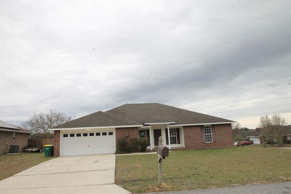 Real Estate Owned All brick 4 bedroom, 2 bath home offering approximately 2,296 SF with an open floor plan and 10 foot ceilings in the main living area. Conveniently located for an easy commute to Duke Field and the Special Operations facilities. The kitchen opens to the living and dining areas and includes microwave/hood, refrigerator, dishwasher. Wood flooring in both the breakfast area and formal dining room. The master suite features a clawfoot tub, separate shower, and double closets. Both baths have tile flooring. Sliding glass doors lead to a patio and privacy fenced backyard. Double garage includes pegboard walls for storage. Call to take a look at 5211 Moore Loop today.