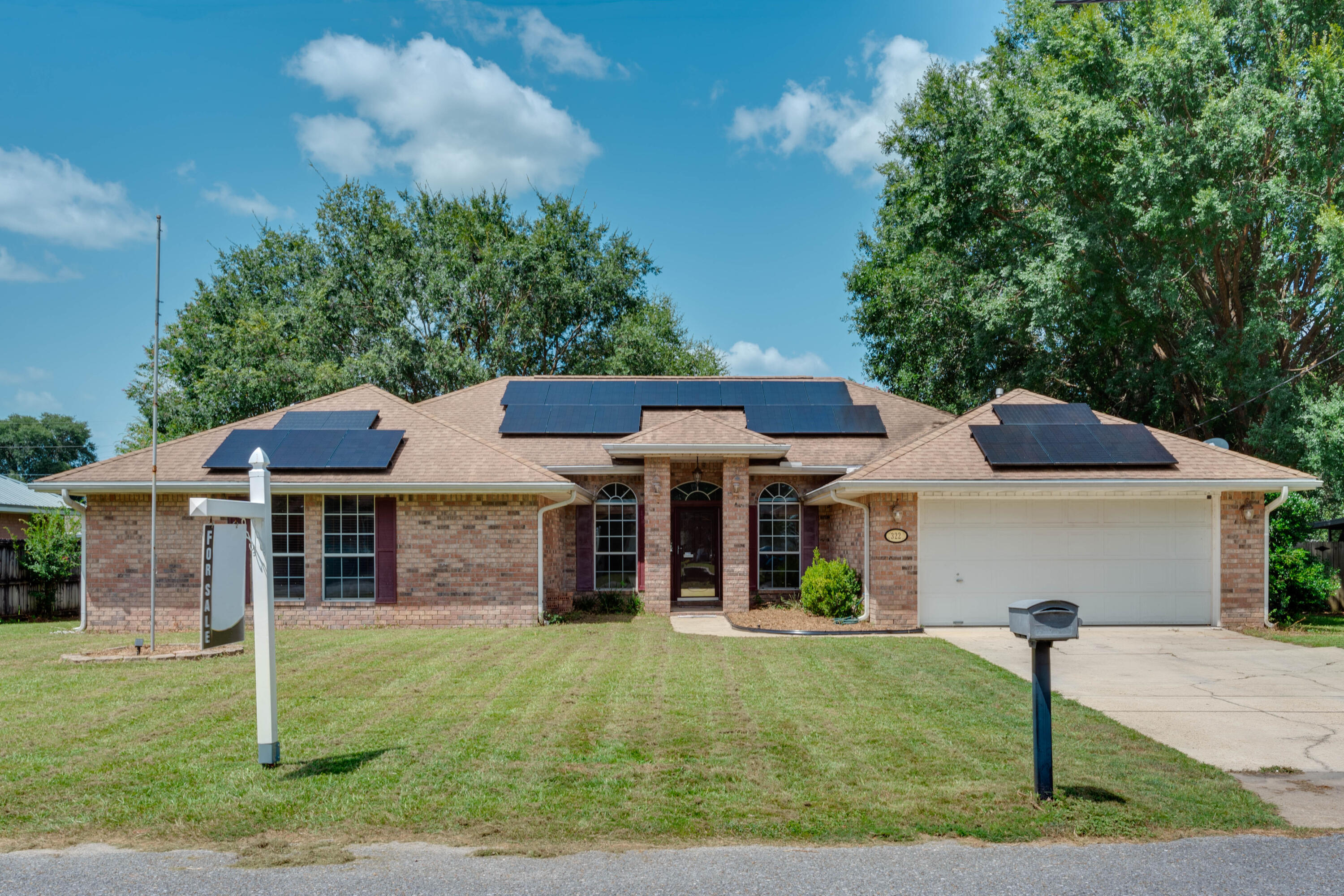 Beautiful single-family home in a great family neighborhood with a new interior air conditioner system installed in 2023 and a $50,000 solar panel package decreasing the home's power bill to an average of $30 a month! (see attached power bill) This home is close to Niceville, Fort Walton Beach or Destin as well as Duke Field and Eglin Air Force Base.  Walk through the front door and you are greeted by a formal living room to the right and a flex space to the left (currently used as an office).  Continue through to the exceptionally large family room that boasts a fireplace and access out to the backyard and outdoor kitchen. The kitchen offers granite countertops, lots of cabinet space and a large kitchen island.  From the kitchen you have a laundry room with a pantry that leads to a two-car garage.  The primary bedroom is quite large with plenty of space for a king-sized bed along with an oversized en-suite bathroom and walk-in closet.  With the three additional guest bedrooms and bath makes this home a perfect family home.