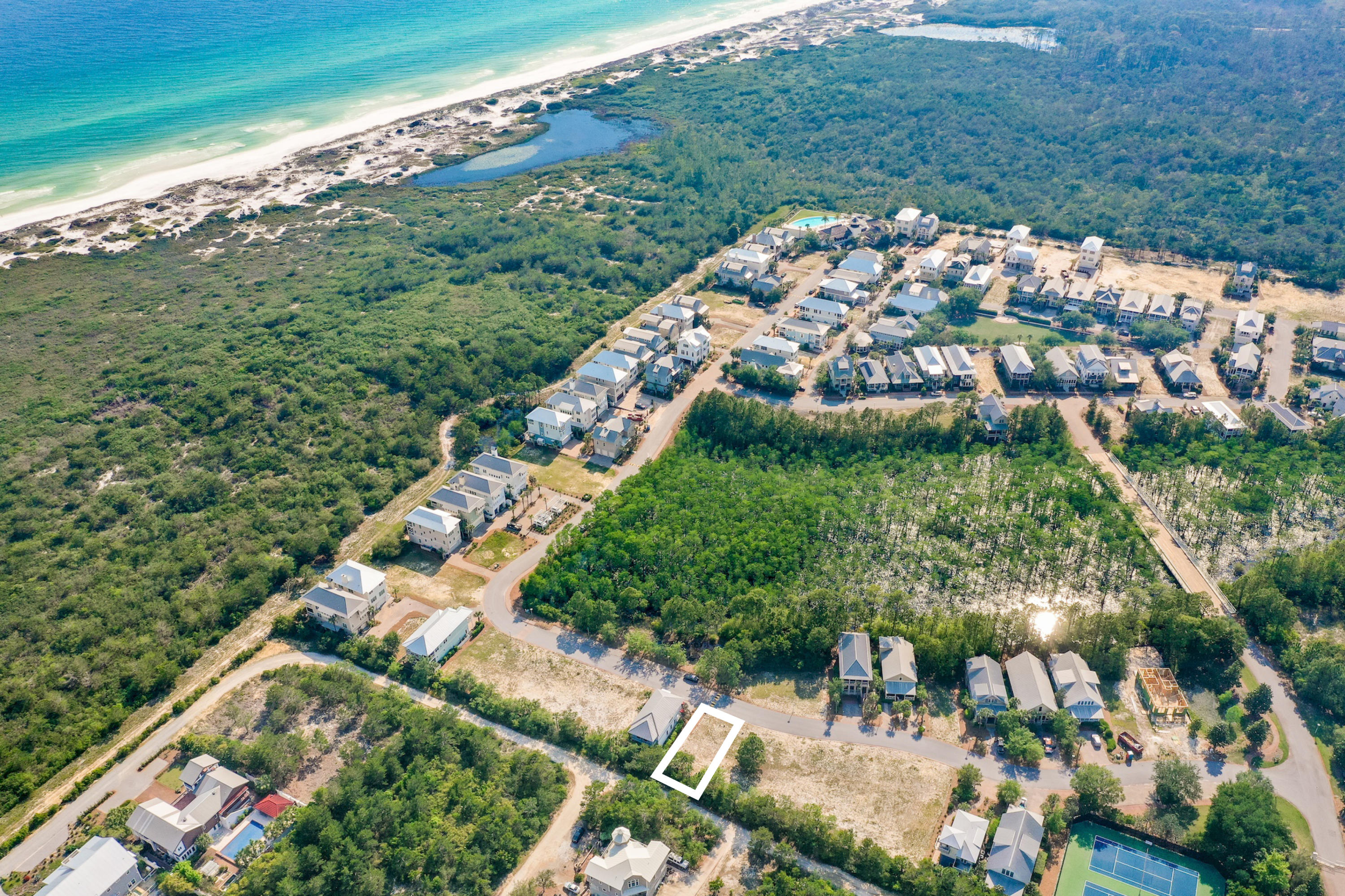 Great homesite on the East side of Cypress Dunes! Backs up to the outer perimeter fence. Depending on the plan you choose you could possibly have Gulf of Mexico views from this location. John Willis Homes is the exclusive builder and has built all the amazing homes in the community. John Willis is known for his custom homes with quality design selections and craftsmanship.  There are 3 different floor plans that fit this lot. Cypress Dunes is completely surrounded by Topsail Hill State Park and nature. The state of the art amenity center has Gulf of Mexico views , an infinity edge pool, a fully equipped workout facility, sunset deck, outdoor fireplace, owners room with a 90 in TV and commercial kitchen, a second pool in Phase 2, tennis courts, boardwalks through nature and Cypress Ponds! T The well known Sandestin Golf & Beach Resort is just 5 minutes away with 4 award winning championship golf courses, 15 world class tennis courts, 113-slip marina, water sports and the famous Baytowne Wharf. Grand Boulevard Shopping Center offers a movie theater, Publix grocery, Sacred Heart Hospital, name brand shopping and restaurants like Flemings Steak House, PF Chang's, and Emeril's.