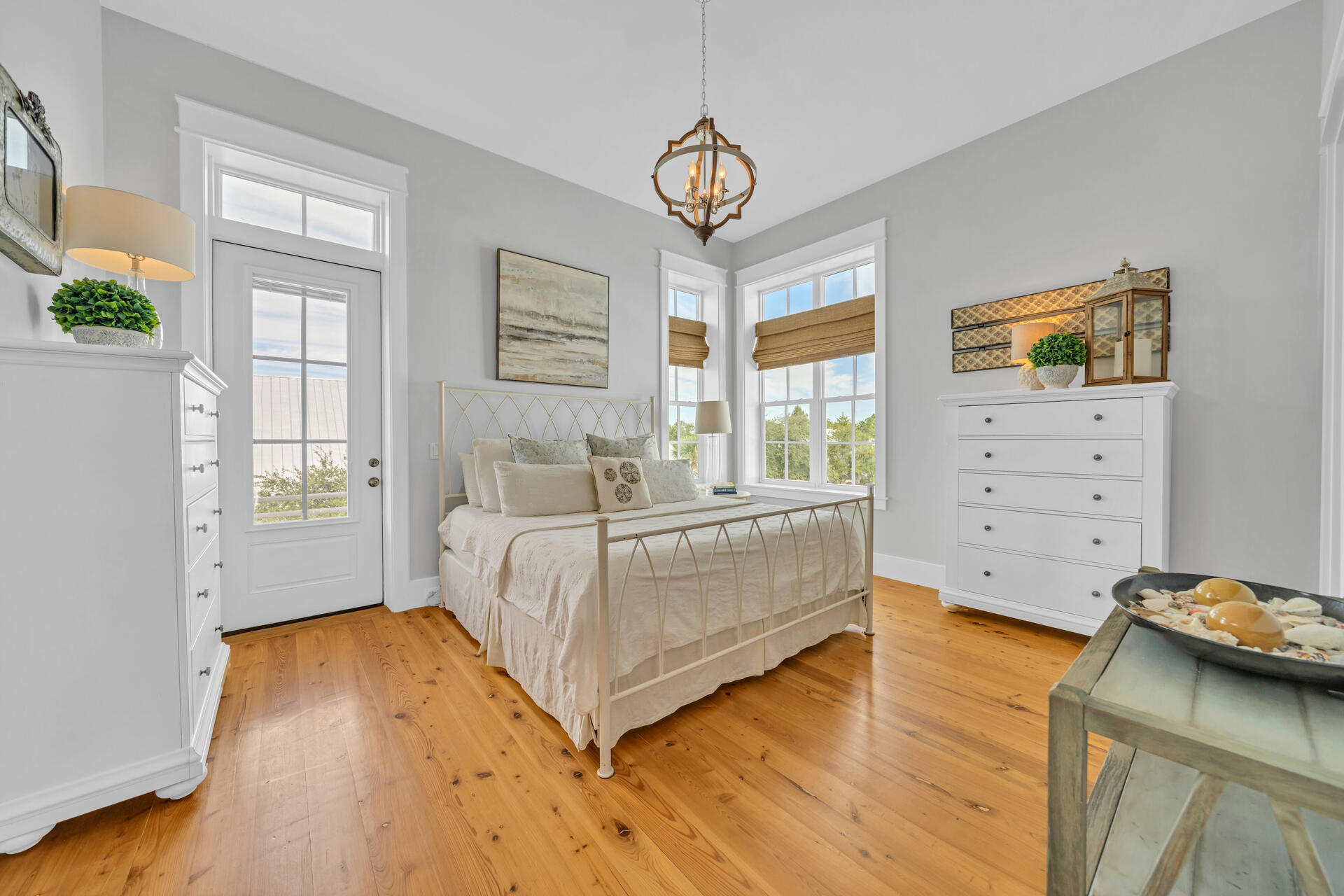 This Craftsman Style Beach House features 3 large, with 2 of them being Master bedrooms, all with en suite bathrooms and balconies. The Master bedrooms have walk-in closets and large showers. The upstairs Master has a gorgeous garden tub. This home is constructed with Interlocking Concrete Forms (ICF) which makes it energy efficient and sturdy in Florida storms. 
With this home having a reversed floor plan-it allows for an open concept kitchen, dining and living space. A large private balcony off the back of the home looks onto a densely forested property and Cypress Dunes community famed 100+ year old Cypress pond. You will find nature at its best as you will see deer, raccoon, and fox pass through behind the house. The kitchen boasts an expansive island area with seating, a walk-in pantry, and a bar area with a built-in wine refrigerator. The kitchen has a Bosch refrigerator. The den has 15' vaulted ceilings. Transom windows on the 2nd floor allow for sunlight to flood this home.
An oversized one car garage allows for storage and a workbench area. There is also a decked in crawl space underneath the home for storage. Beautiful landscaping with flowering plants greet you as you drive up.
This home is completely updated form inside to out. Updated paint inside and outside, countertops, backsplash, faucets, and lighting. The unique Cypress wood floors are displayed throughout the house.
You need to see this home to take in all of the features and updates. This home comes mostly furnished with many pieces from Pottery Barn and local businesses. 65" Samsung TV with Bose speaker system stays with the home.