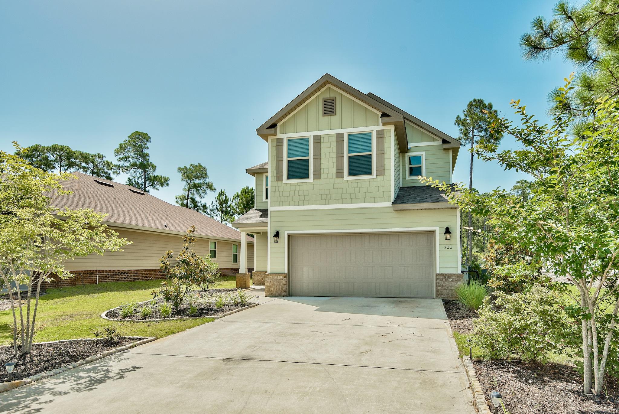 This peaceful 2 story home is located in the wonderful neighborhood of Driftwood Estates. Backing up to the lake, this 4 bedroom, 2.5 bath home is centrally located near Publix, Grand Boulevard and the beach! The first story includes an open floor plan with a large living room, dining area,half bath and laundry room. The first floor also includes a sunroom perfect for a home office or second living area that also opens up to the back porch. The kitchen features beautiful granite counter tops, modern white cabinetry and spacious island. The stunning staircase and high ceilings lead to all 4 bedrooms and 2 baths. The large master suite includes a separate sitting area and walk in closet. The master bath not only features a sizable, separate tile shower but also a relaxing garden tub and double vanities. The guest bath also features double vanities and granite counter tops. The backyard is a peaceful oasis backing up to the lake with plenty of room for entertaining or just relaxing and enjoying the view. The possibilities are endless on this large lot.