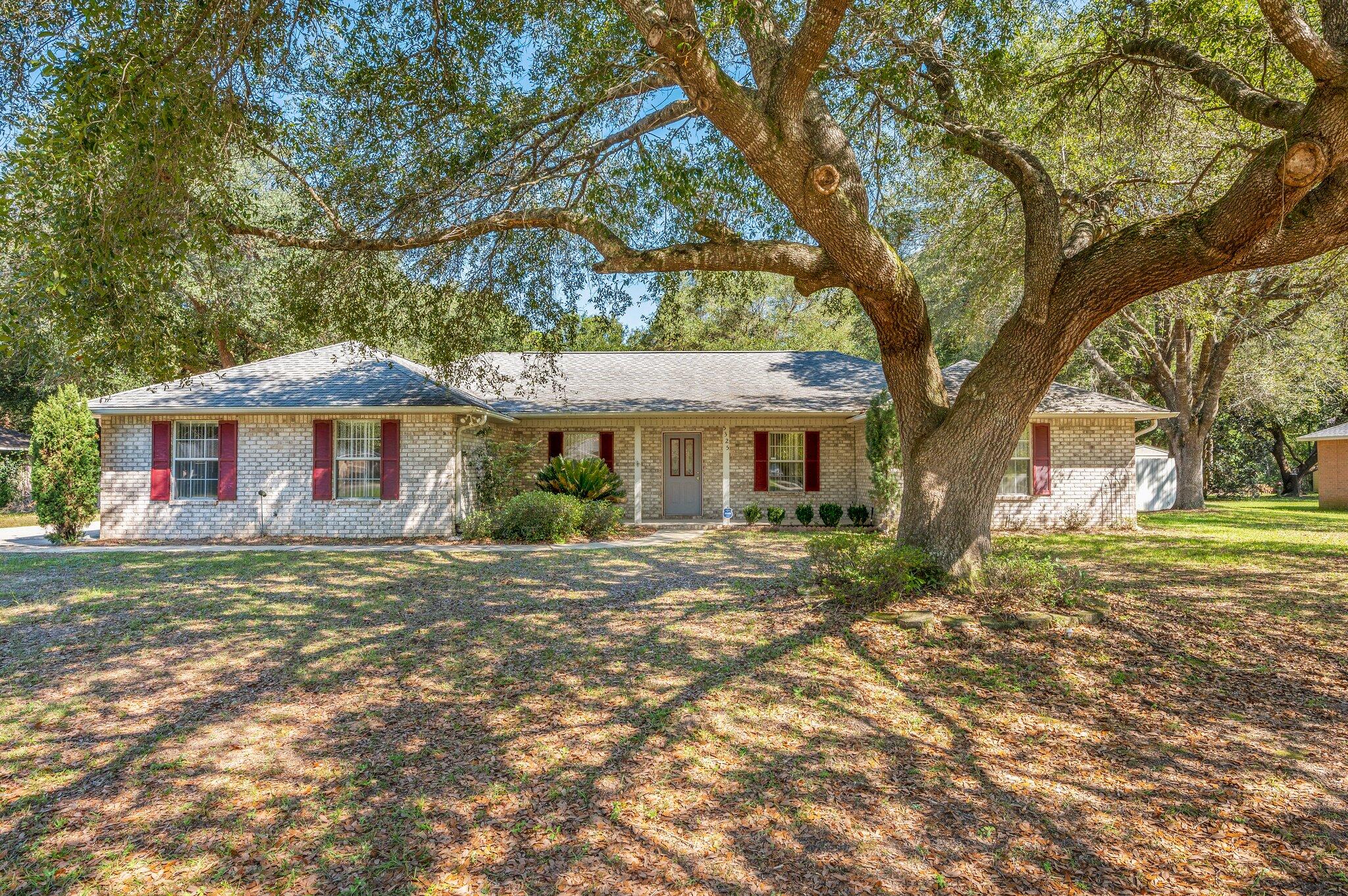 Stop the car and look no farther. This meticulous maintained brick home is a must see in a well established neighborhood. Your new home is sure to check the boxes for your needs and hearts desires. To name a few your new home features a high cathedral ceiling and fireplace in the living room, granite counter tops in the kitchen, a massive master suite, and an enclosed heated and cooled Florida room to name a few. Outside will not disappoint either with the large .71 acre lot, a nice covered front/rear porch, a detached finished man cave that will make for the perfect backyard getaway or entertainment hotspot, workshop, and a large fenced in back yard that is perfect for the kids and dogs to roam and play. Seller will replace the roof prior to closing with an acceptable offer.