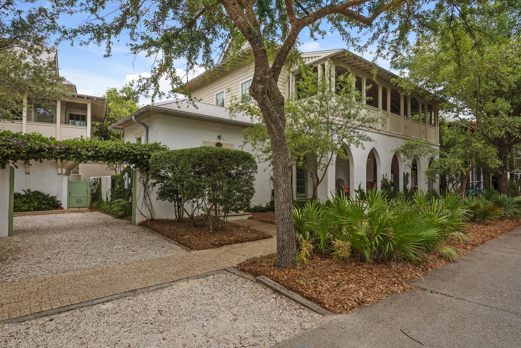 Conveniently located near the shops and restaurants of Rosemary Beach Town Center, lies this beautiful 4 bedroom, 4 bathroom family home. With over 2,500 sq. ft. of open living space, an expansive wrap around porch and balcony, and a charming private courtyard, this home is perfect for entertaining guests or enjoying time with your family. Warm wooden floors, stone counter tops and marble accents are found throughout this incredible property.
Relax in your luxurious master suite with a large soaking tub, steam shower and double vanities. Enjoy the flow through French doors that open up to the private courtyard, and accommodate guests in the quaint separate carriage house over a 2 car garage. Nestled in the community of Rosemary Beach, 62 Georgetown Ave is just a short walk to the Gulf of Mexico and located near 4 community pools that all Rosemary residents have access to. Residents are also able to use high end amenities like a fitness center and the tennis racquet club, not to mention Rosemary is home to some of the best shopping and dining on 30A!