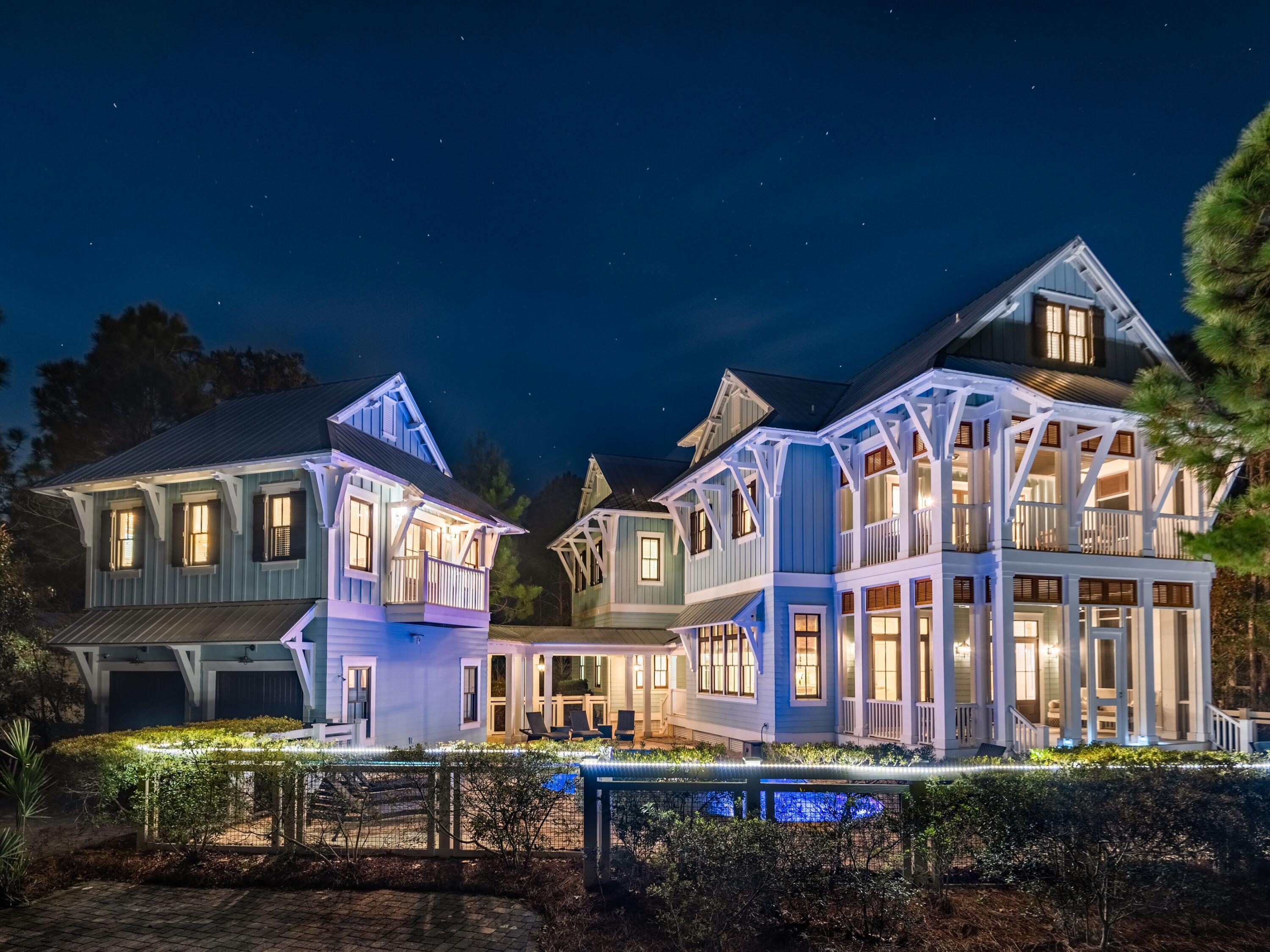 Designed by TS Adams Studio, this WaterColor masterpiece is an exceptional collection of amenities and location. From its spacious floor plan of just under 5,000 square feet to its thoughtful finishes including pecky cypress ceilings and wide-plank refinished flooring, this home is one of the top rentals in WaterColor thanks to its lush, private setting; large, heated pool; and, generous pie-shaped lot that overlooks a serene pond. Step beyond mature pines to the multiple porches and on into the interior of the home, which features all en suite bedrooms — ideal for large gatherings or corporate retreats. The gourmet kitchen boasts top-of-the-line appliances, marble countertops and a massive breakfast bar with seating in an open-concept design. A large dining area has seating for 10 and spacious living spaces give everyone their own nook. The interiors are only outdone by the resort-style outdoor spaces this home provides including a heated pool with sun shelf and water feature, hot tub, outdoor fireplace and kitchen, audio surround system, outdoor shower and plenty of deck space for relaxing and entertaining. Parking is ample for at least four vehicles. Guests will also enjoy the well-appointed carriage house that sits above a two-car garage with combined living/sleeping quarters, a private bath and a full kitchen. In addition to the remarkable property features, WaterColor guests have access to a host of world-class amenities including a beach club, Camp WaterColor, outdoor recreation opportunities and all of the shopping and dining your heart desires. Situated between Camp WaterColor and Publix in WaterColor's Phase II, this property is a respite not soon to be forgotten.