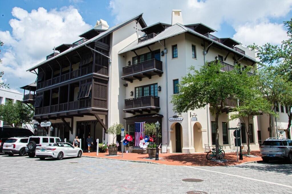 Top of the Town, luxury condo overlooking Barrett Square, in the heart of Rosemary Beach, with glimpses of the gulf from your 3 private balconies, and the best seat in town for the many seasonal events emanating from Barrett Square.  This immaculate and functional condo has over $105K actual rental income on the books YTD.  Offered fully furnished, rental ready, this condo features 2 bedrooms and 2 full baths and sleeps six.  You'll love the white Carrara marble countertops, Viking and Sub Zero appliances, and beautiful tile work in the kitchen and bathrooms.  New AC, July 2024, new roof, new bathroom vanity, new washer and dryer, and the elevator service in Barrett Place is from the underground parking garage or ground level lobby.  You will treasure the deeded personal storage unit in the garage and an assigned parking place for you or your guests.