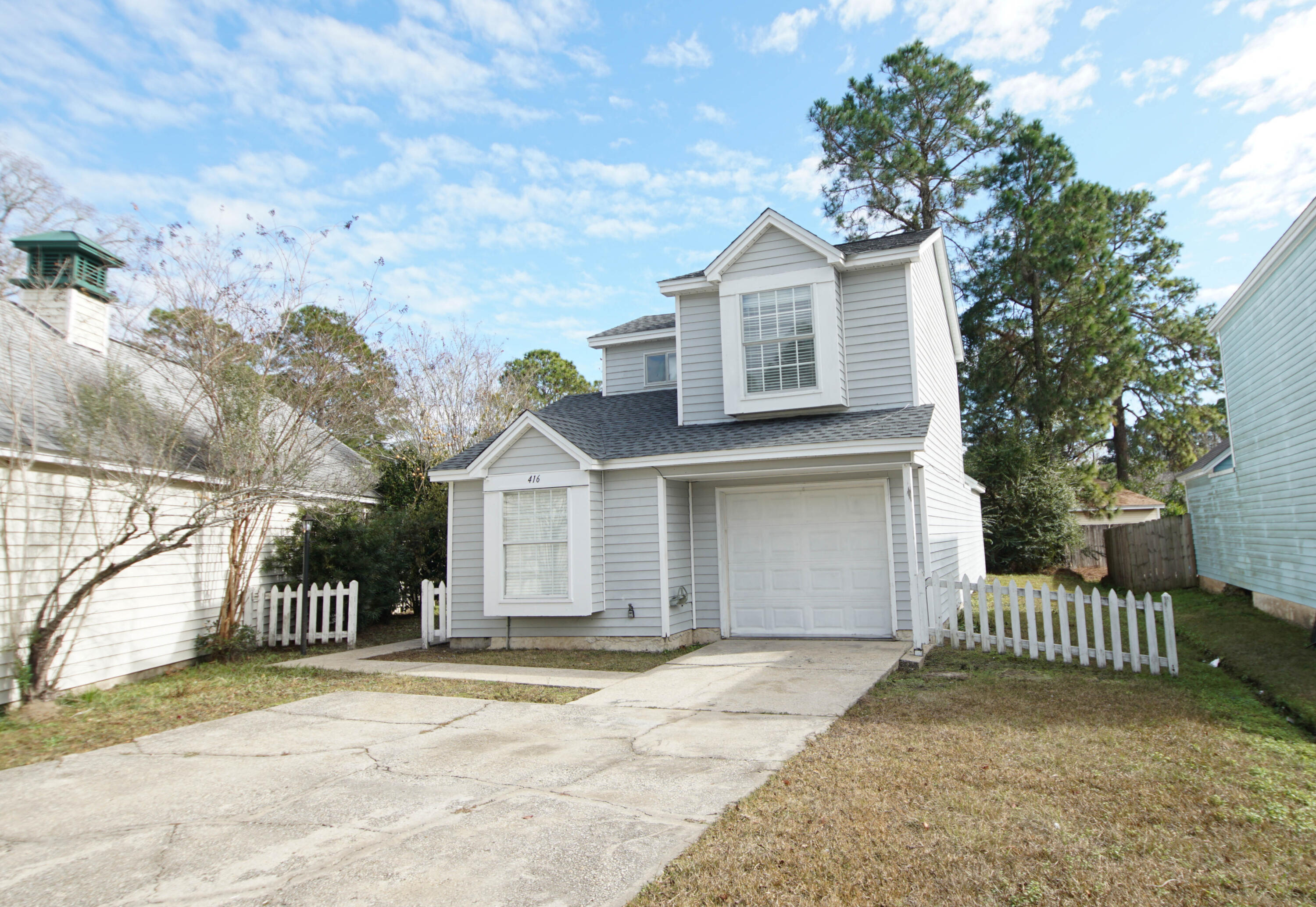 Florida cottage conveninetly located between Eglin and Hurlburt and near  UWF and NWFSC FWB campus.   New dimensional shingle roof installed in August. Kitchen features tile floors and pass through space to the Dining Room. There's a small enclosed atrium off the kitchen. Downstairs has tile flooring, 2 guest bedrooms (upstairs) have carpeting.  Master bedroom has vaulted ceilings, for a more spacious feel.  plus two closets.  Great room also has vaulted ceilings and a fireplace.  Fogged windows repaired/replaced. Ring floodlight camera at the front door for security. Nest smart home thermostat (works with Alexa or google). Interior has fresh paint, new bathroom vanities with quartz countertops.  Home is move in ready.